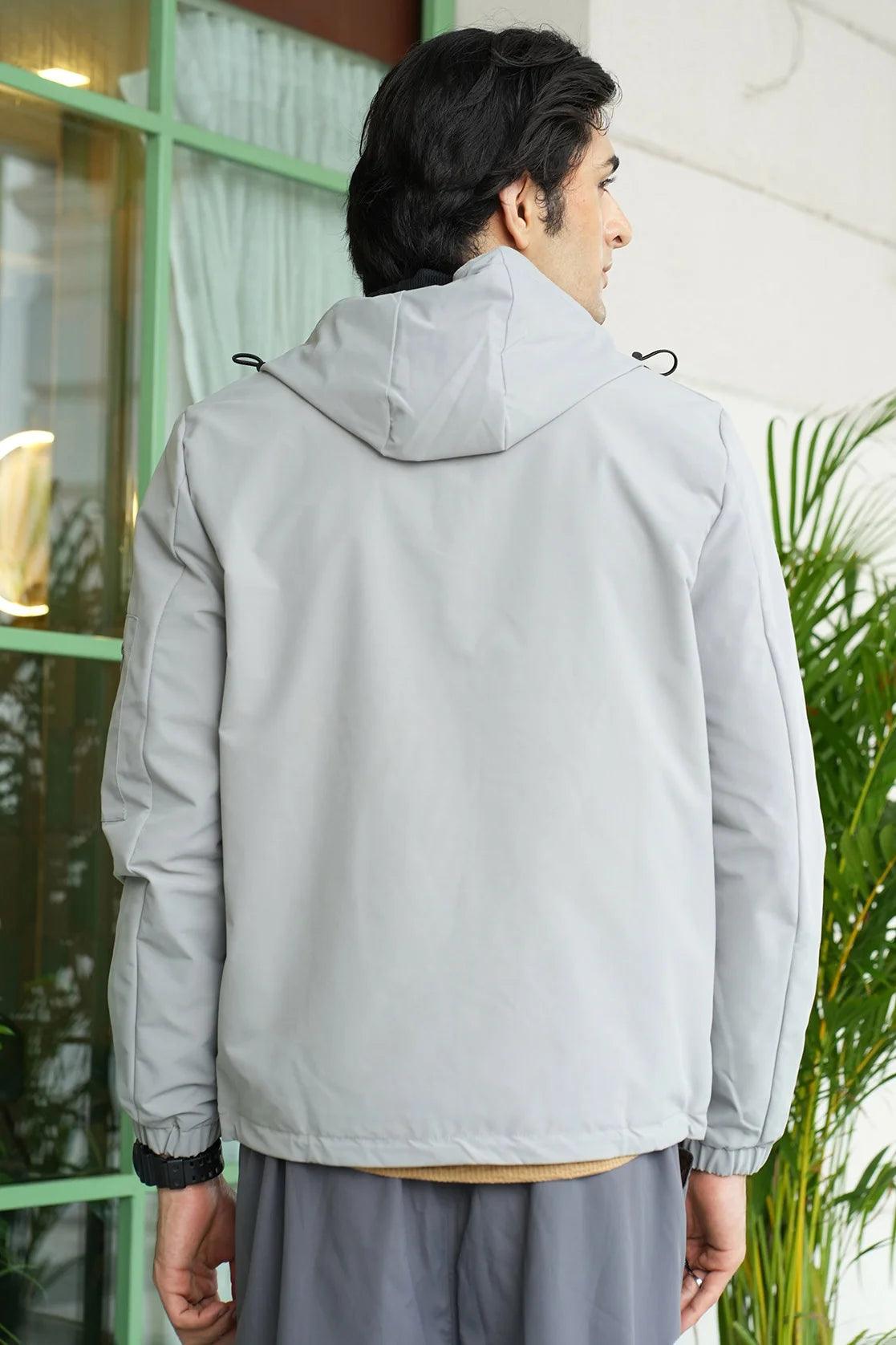 This Men's Grey Windbreaker Jacket from Fort Collins features an adjustable hood and a mesh lining. It is currently available for sale online in India.