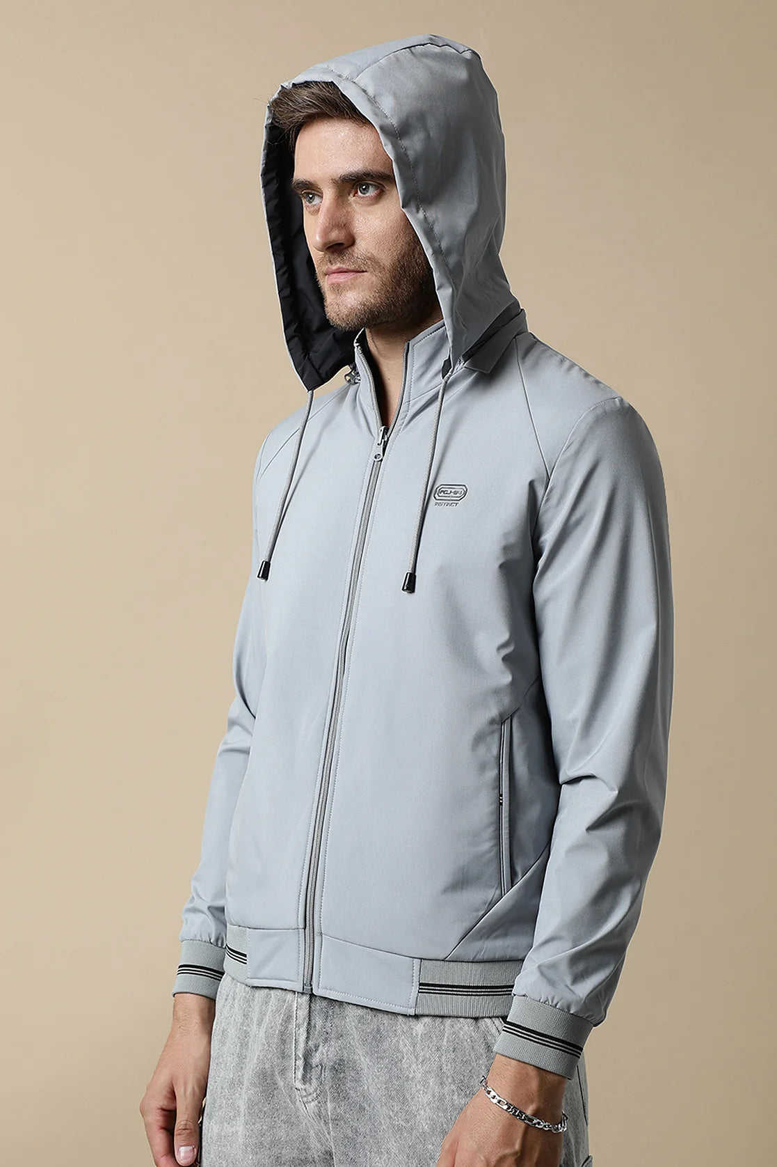 Discover the stylish and versatile Fort Collins Men's Light Grey Reversible Windbreaker, featuring a detachable hood. Upgrade your wardrobe with this must-have piece, available for online purchase throughout India.