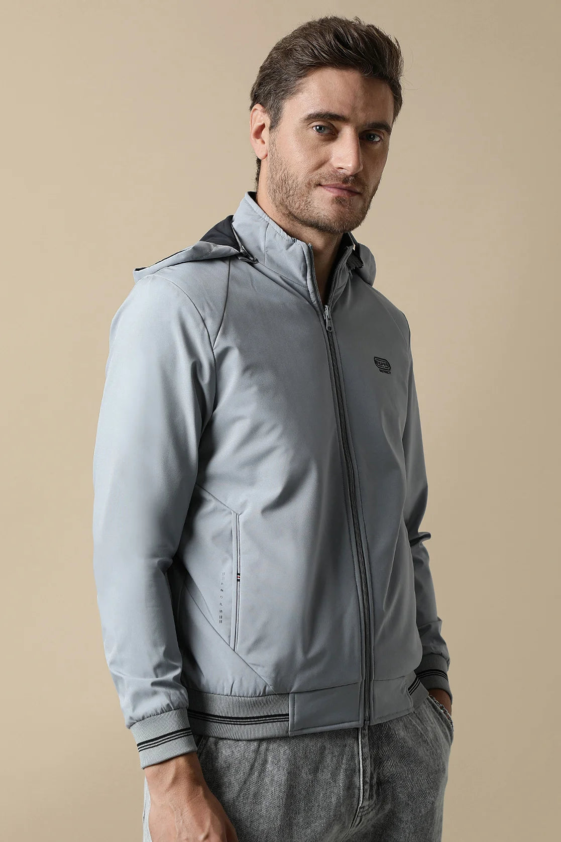 Upgrade your wardrobe with the Fort Collins Men's Light Grey Reversible Windbreaker, complete with a detachable hood. Shop online now for a stylish addition to your collection, available to purchase from anywhere in India.