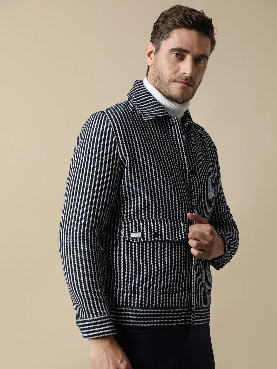 Upgrade your wardrobe with this Men's Navy Striped Tweed Jacket from Fort Collins. This trendy piece features dual pockets and is available for purchase online from anywhere in India.