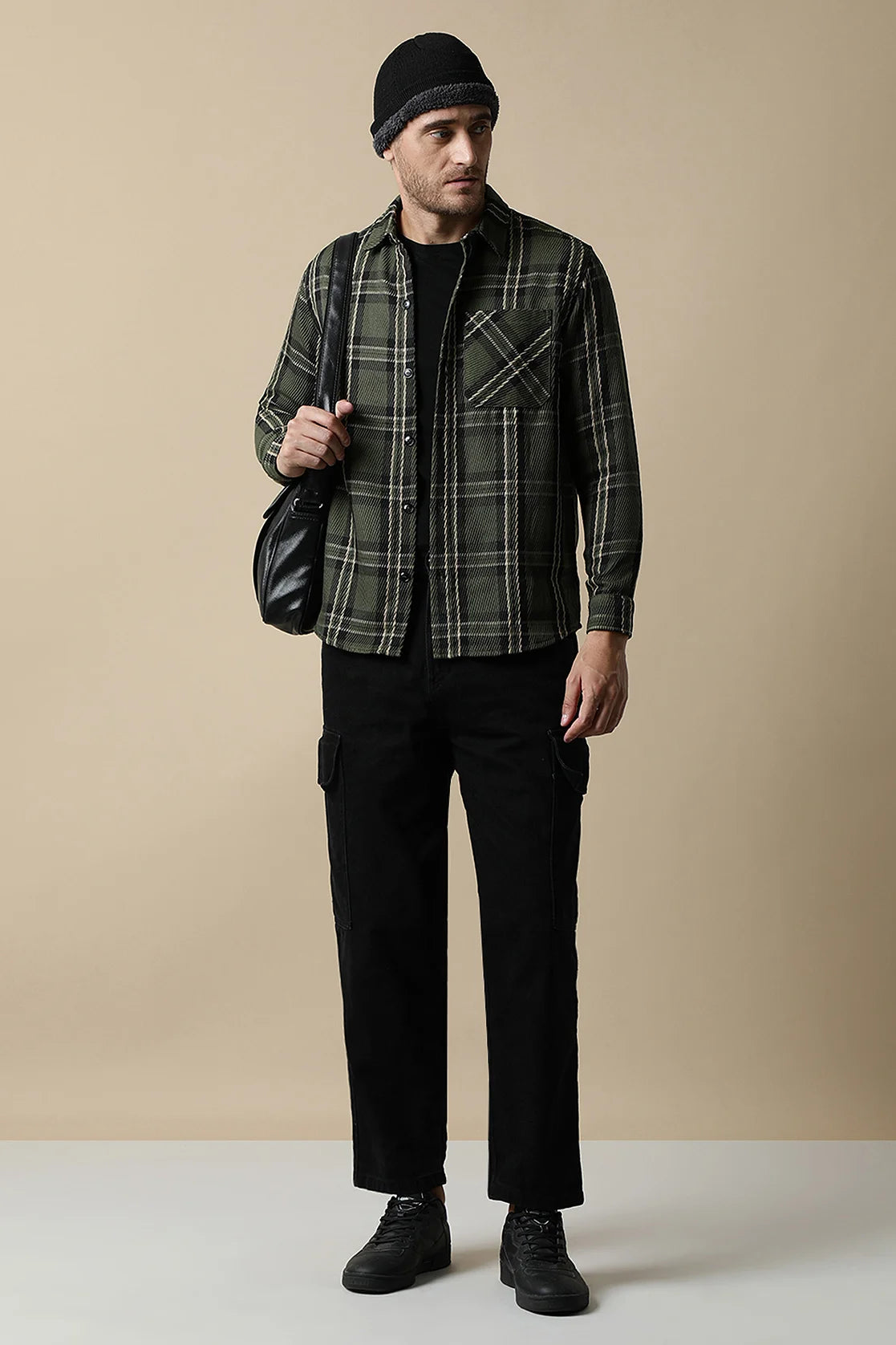 Upgrade your wardrobe with the trendy Men's Olive Green Knitted Plaid Shacket by Fort Collins. Shop online for this stylish piece from anywhere in India.