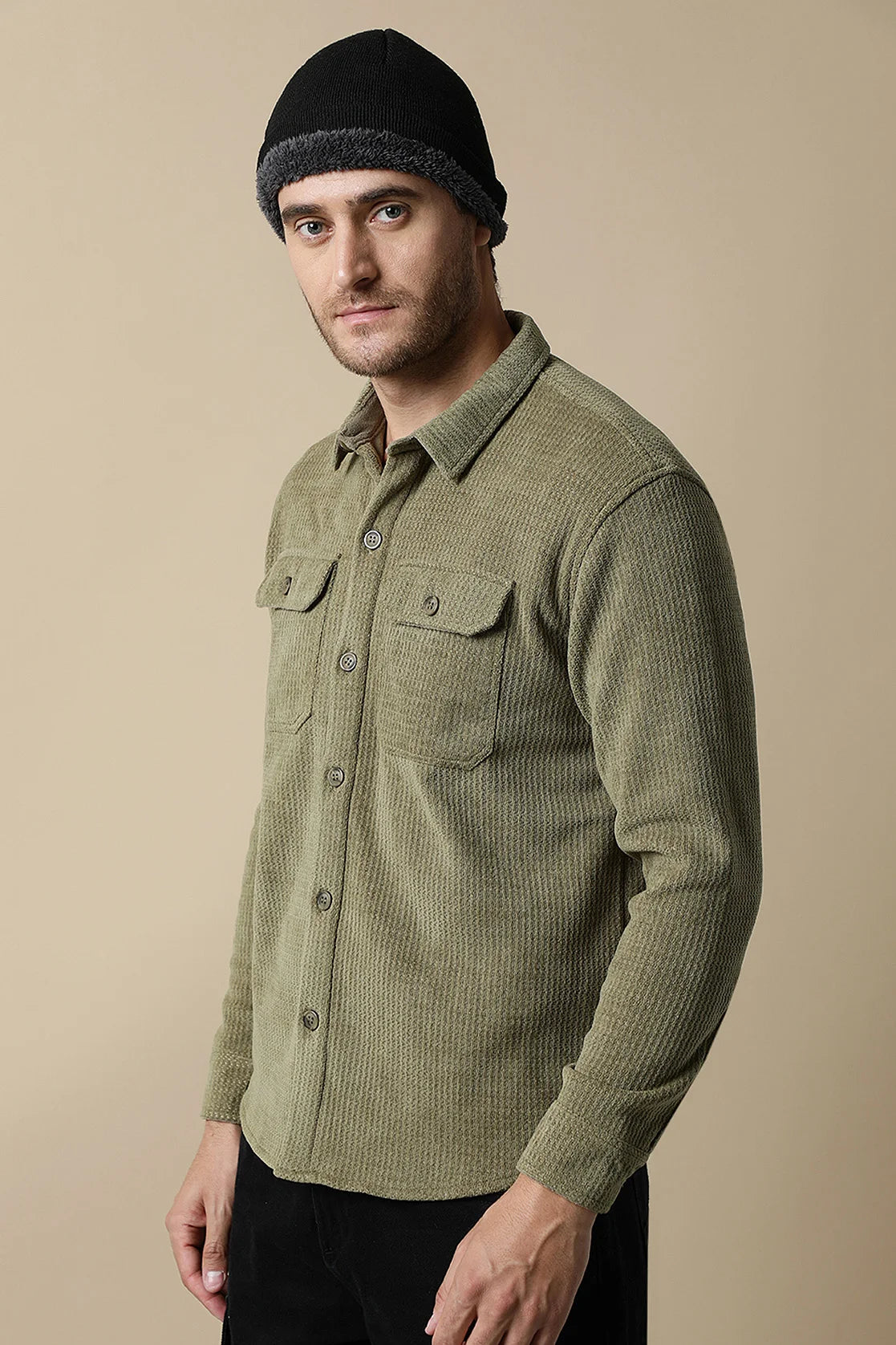 Upgrade your wardrobe with the Fort Collins Men's Olive Green Textured Shacket, complete with dual chest pockets, available for purchase online from anywhere in India.