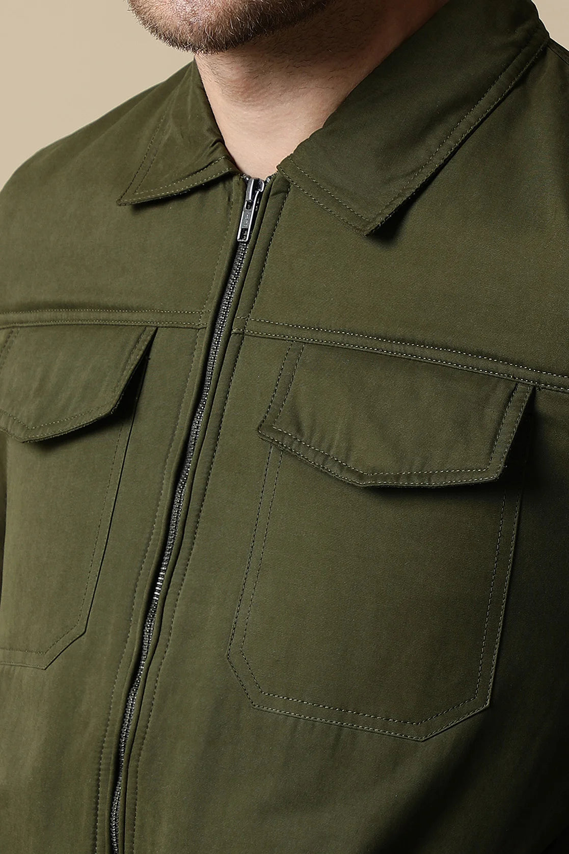 Fort Collins presents the Men's Olive Lightweight Jacket with Dual Chest Pockets for an elevated addition to your wardrobe. Purchase online from anywhere in India for a fashionable upgrade.