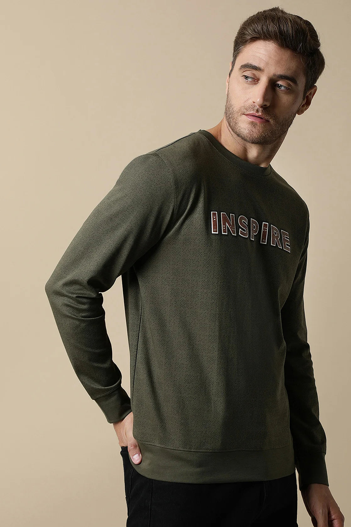 Enhance your wardrobe with the Men's Olive Round Neck Sweatshirt with Chest Print by Fort Collins. Purchase online from any location in India for a stylish and modern look.