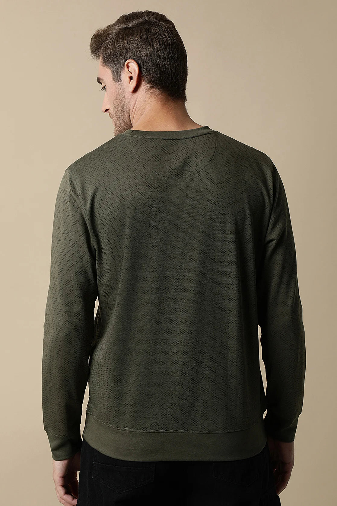 Find a stylish wardrobe upgrade with the Men's Olive Round Neck Sweatshirt featuring a chest print by Fort Collins. Available online from anywhere in India.