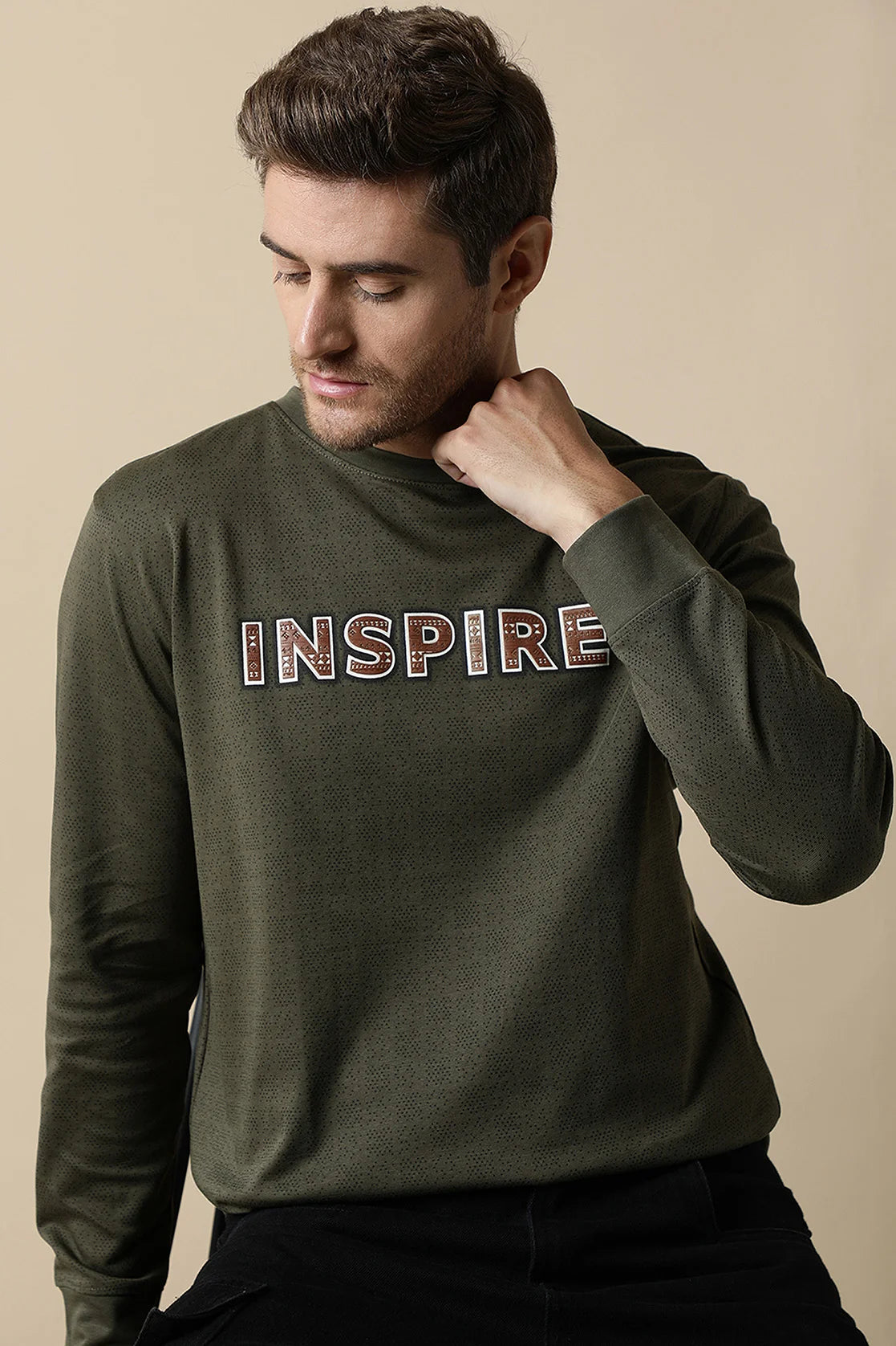 Upgrade your wardrobe with the Fort Collins Men's Olive Round Neck Sweatshirt, featuring a chest print. Shop now for this trendy piece from anywhere in India.