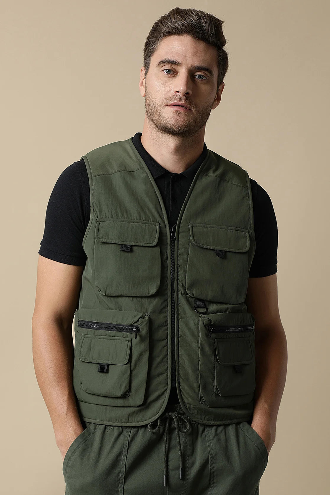 Upgrade your wardrobe with Fort Collins' Men's Olive Tactical Utility Vest Jacket. Shop online from anywhere in India for a stylish and versatile addition to your closet.