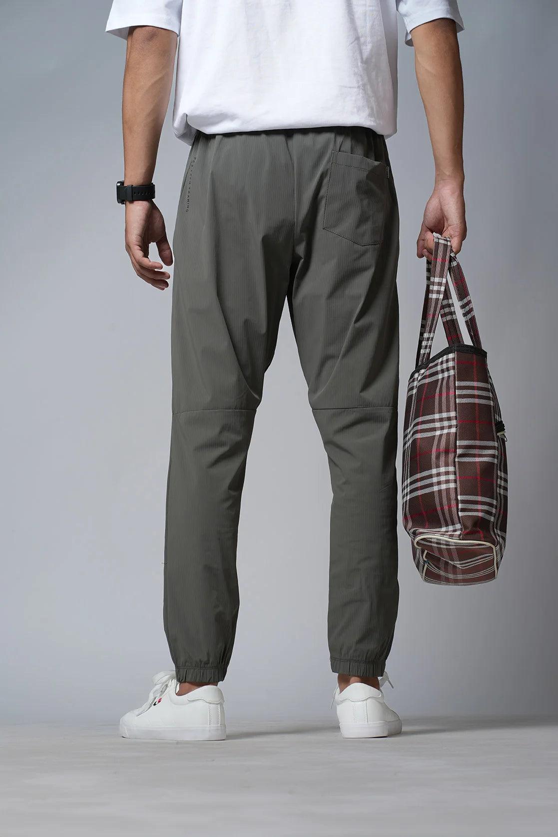 Purchase the Men's Olive Structured Fabric Slim Fit Track Pant with Zipper Pockets from Fort Collins in India