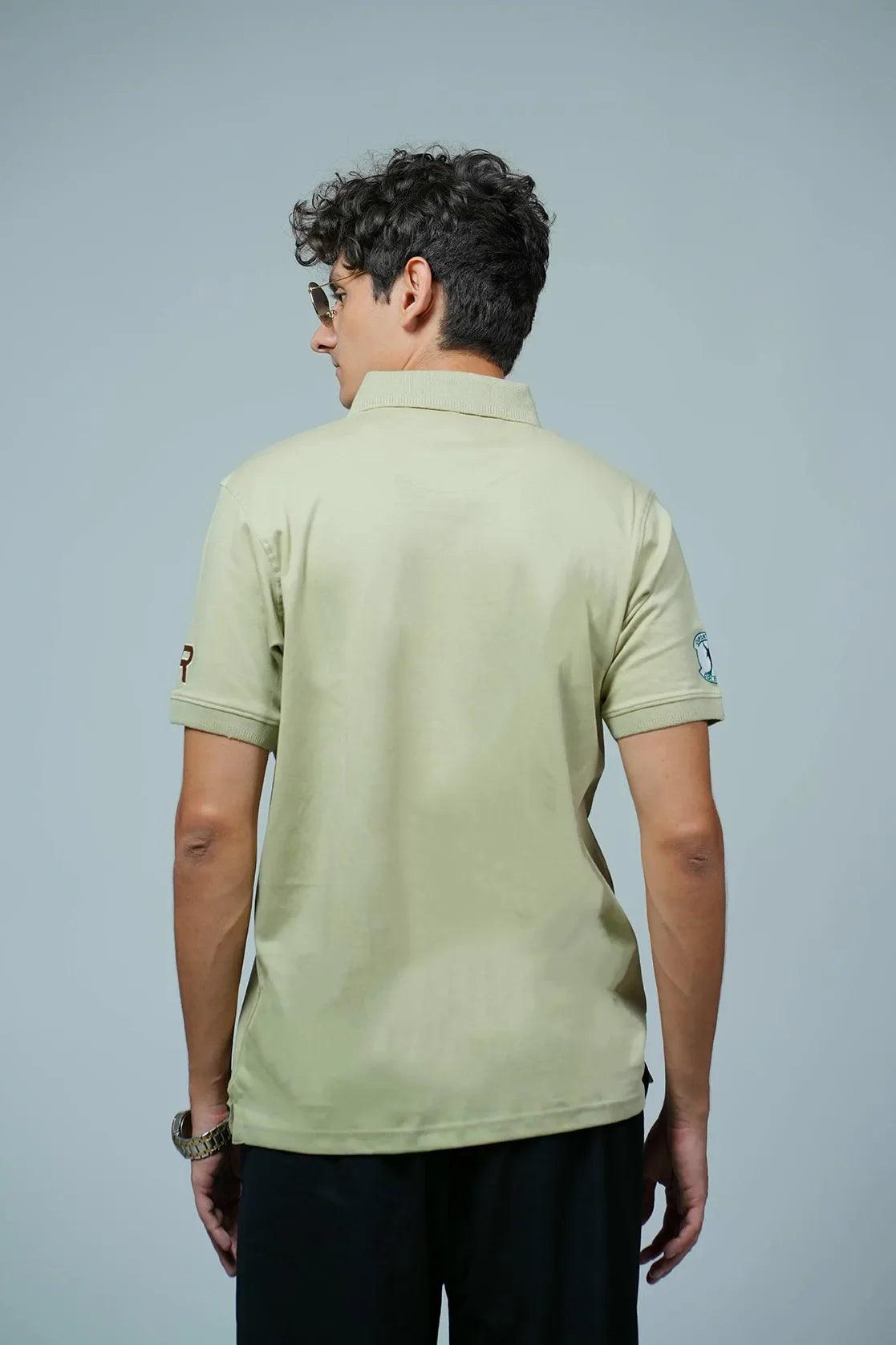 This polo collar t-shirt for men from Fort Collins features a light green color and is adorned with embroidery patches on the front.