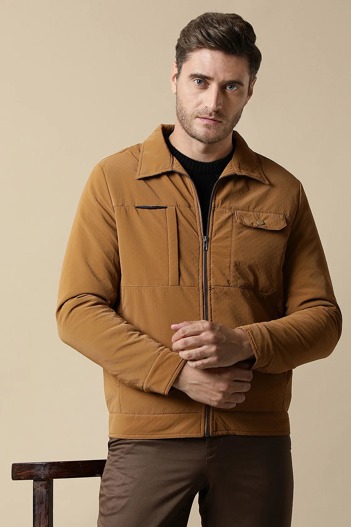 The Men's Tan PU Coated Jacket with Classic Front Zip from Fort Collins is a stylish and versatile addition to your wardrobe. Pair it with the Men's Beige Stretchable T-Shirt featuring a bold New York graphic print for a modern and trendy look.