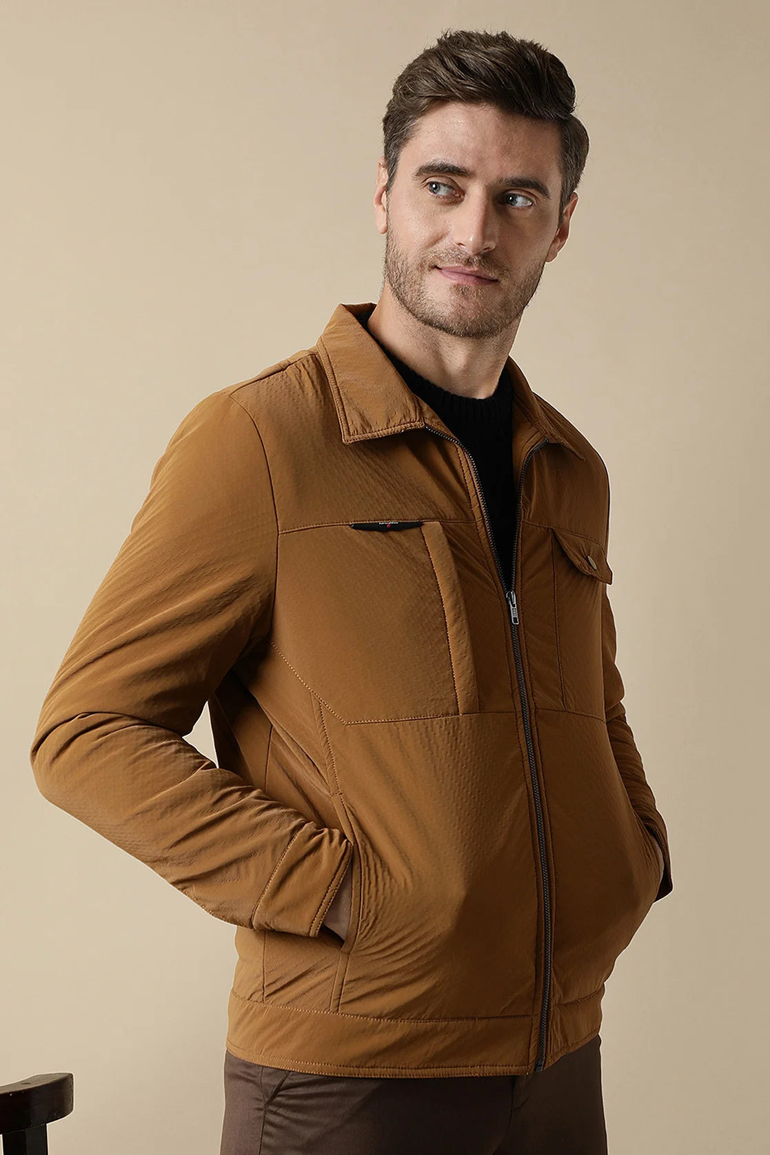 Discover the perfect combination of style and durability with the Fort Collins Men's Tan PU Coated Jacket. This timeless jacket features a classic front zip, while the Men's Beige Stretchable T-Shirt adds a touch of fashion with its New York graphic print.