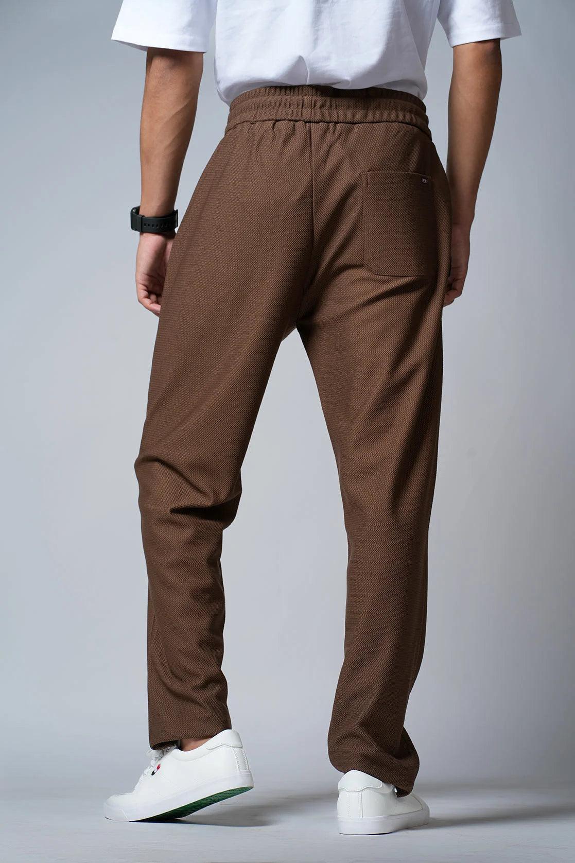 Explore our Fort Collins Men's Tan Track Pants with Zipper Pockets, available for purchase online in India. Our pants are designed with regular fit and feature convenient zipper pockets, perfect for your everyday activities.