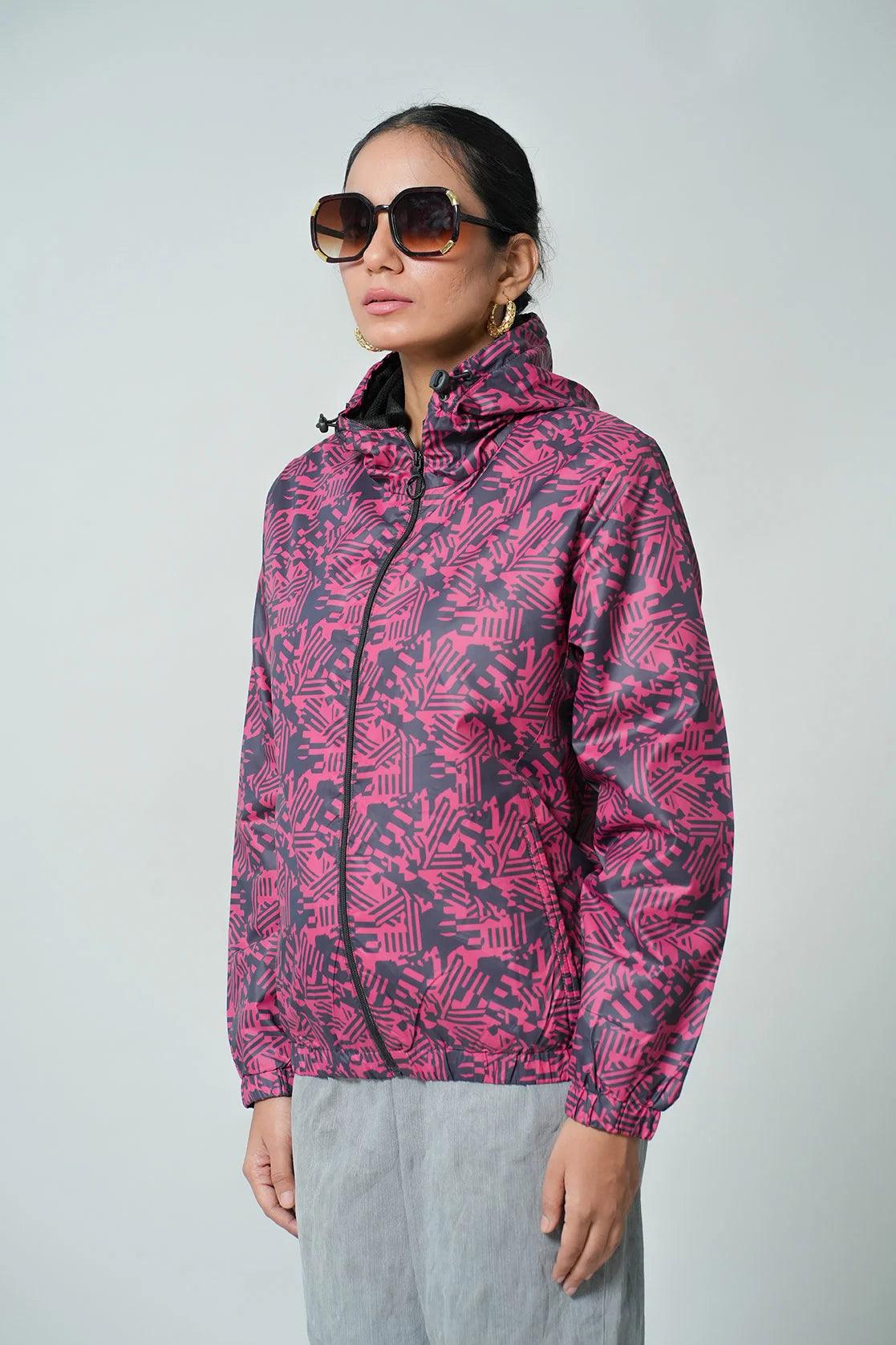 Shop our Fort Collins Women's Red Abstract Printed Windbreaker Jacket with Adjustable Hood, available for purchase in India.