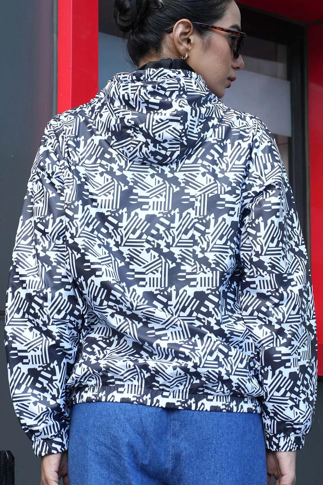 This Fort Collins windbreaker, designed specifically for women, features a white abstract print and is available for purchase online in India.