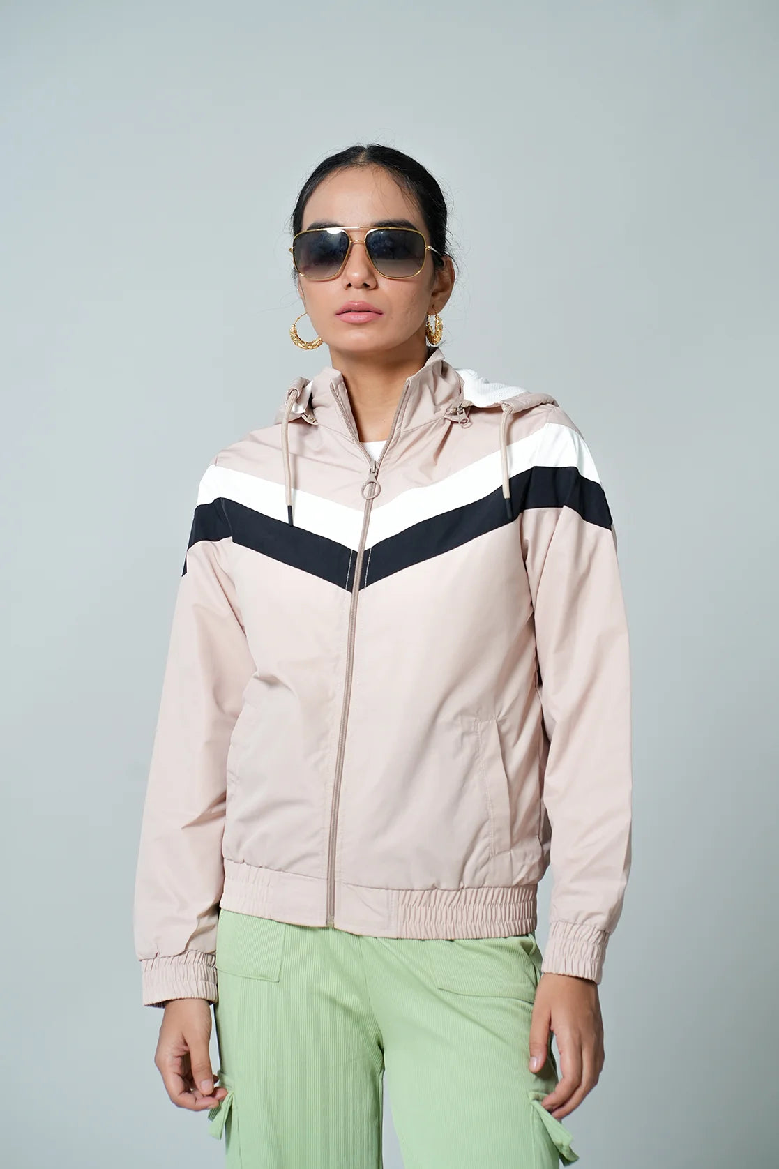 Upgrade your wardrobe with the Fort Collins Women's Beige Chevron Windbreaker Jacket, complete with an adjustable hood. Available online from anywhere in India.