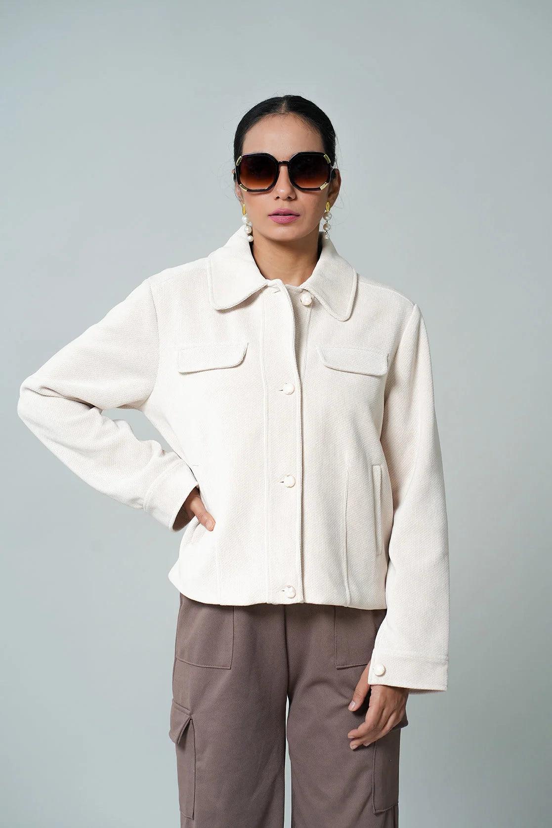 Upgrade your wardrobe with the trendy Fort Collins Women's Off White Knitted Jacket. This professional garment features a button-down front closure and is available for online purchase throughout India.