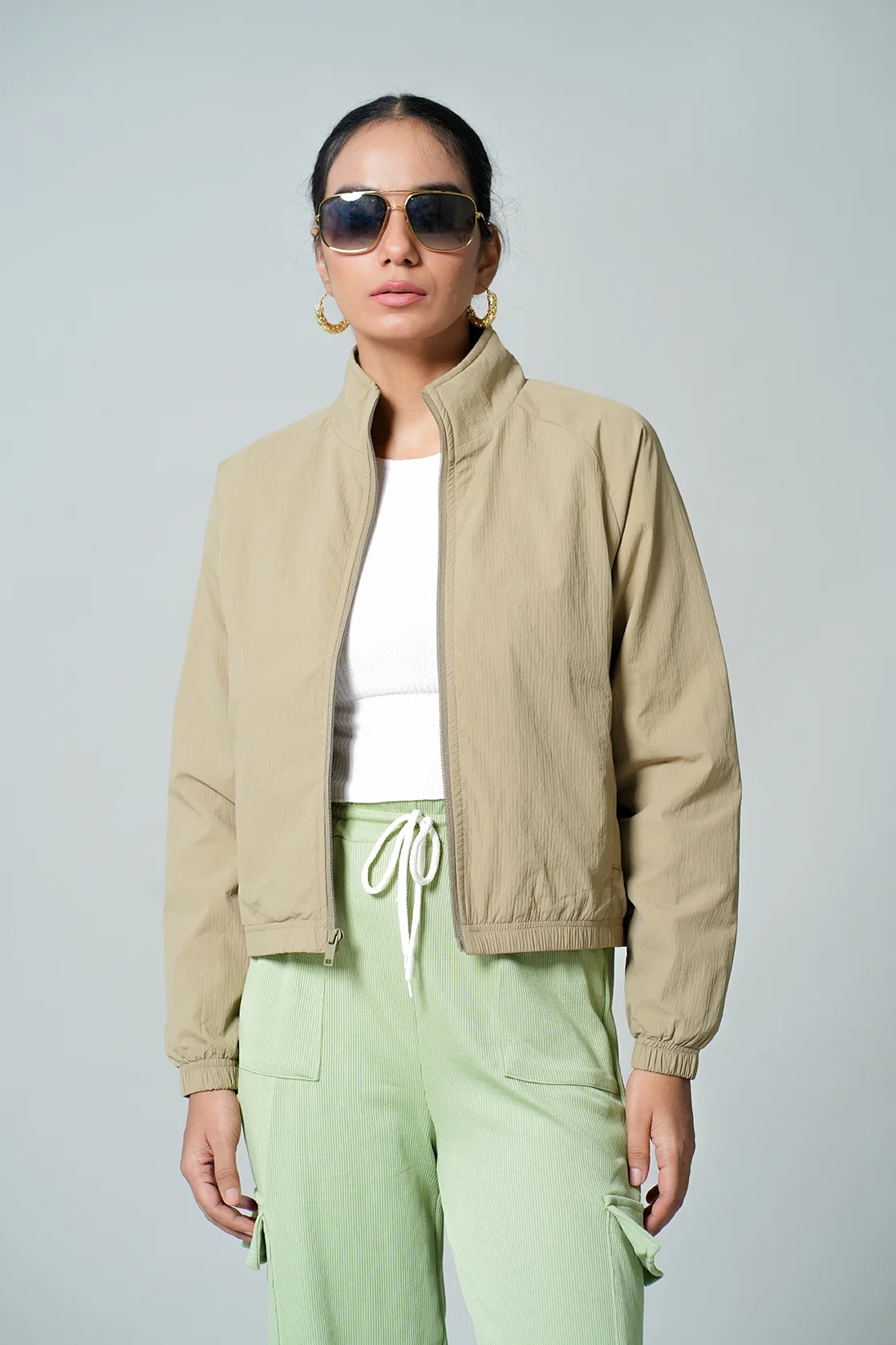 Shop now online for the Women's Beige Lightweight Crop-Length Jacket with Stand Collar from Fort Collins, and elevate your wardrobe with this stylish and versatile piece. Available for purchase from anywhere in India, this jacket is the perfect choice for a modern and fashionable look.