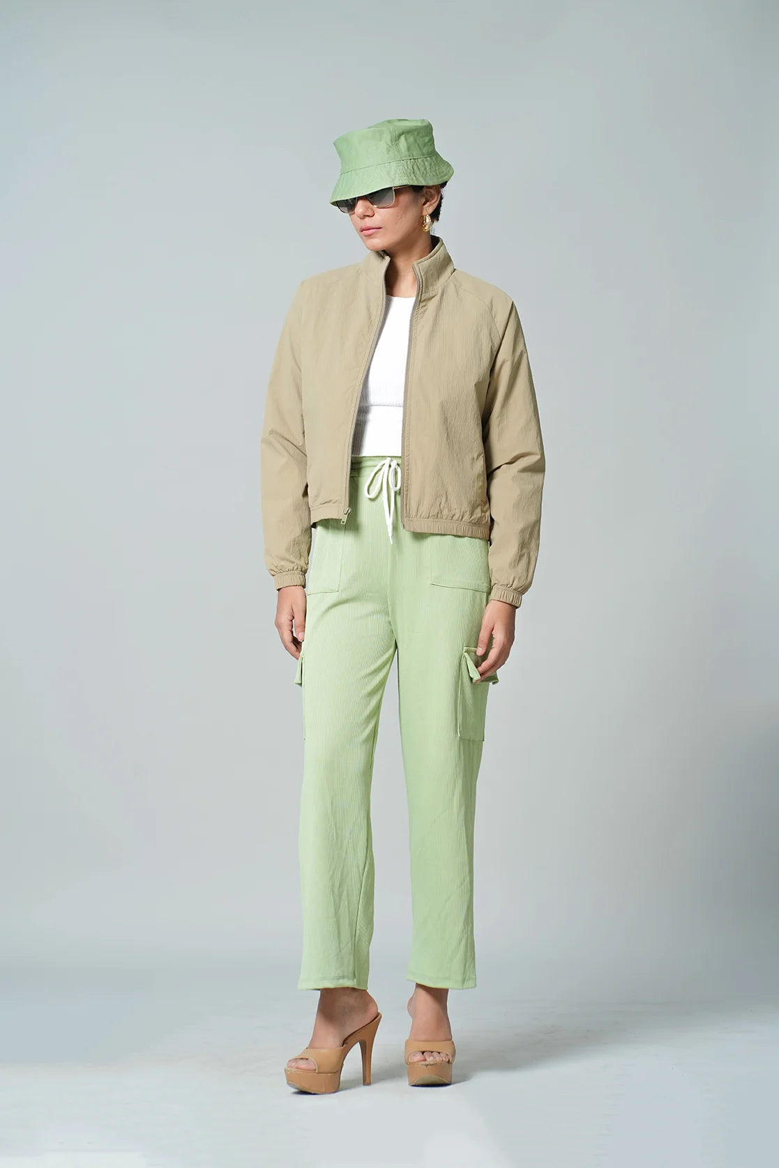 Elevate your wardrobe with the Fort Collins Women's Beige Lightweight Crop-Length Jacket featuring a stylish stand collar. Purchase online now for a fashionable update, available from anywhere in India.