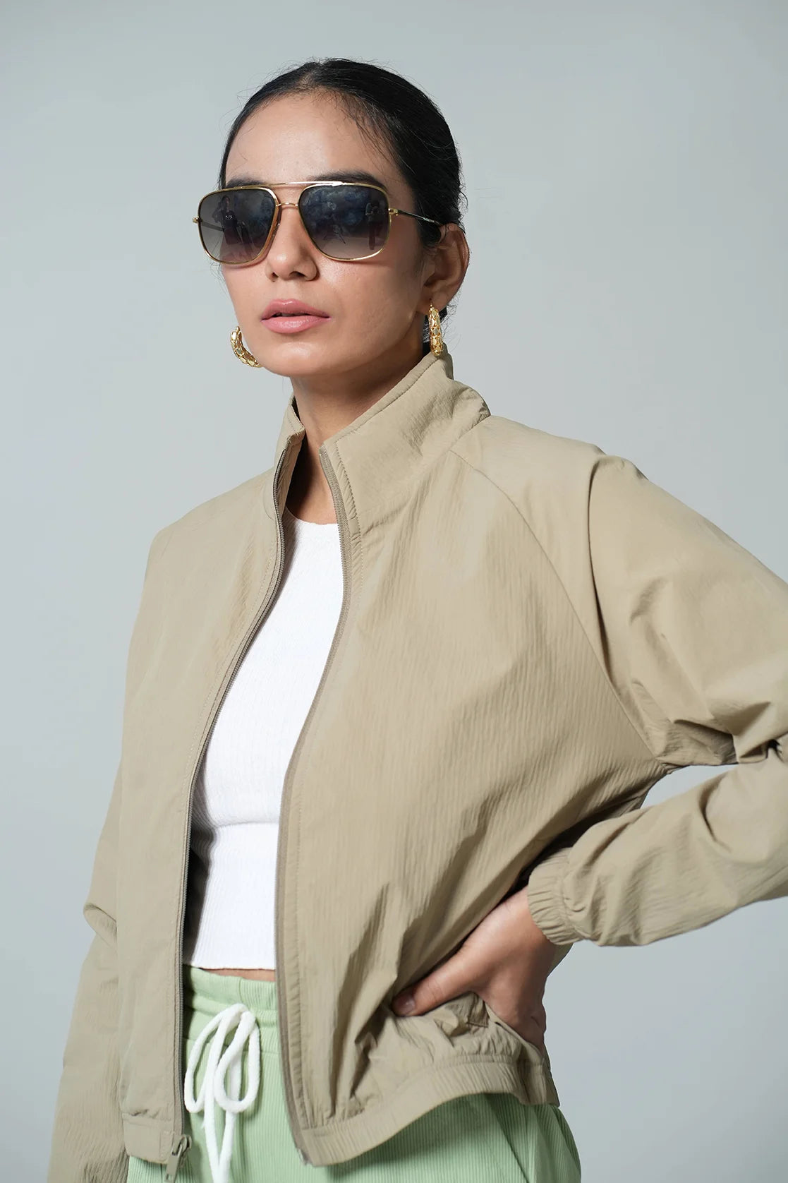 Upgrade your wardrobe with the Fort Collins Women's Beige Crop-Length Jacket. This lightweight jacket features a stand collar and is available for online purchase in India.