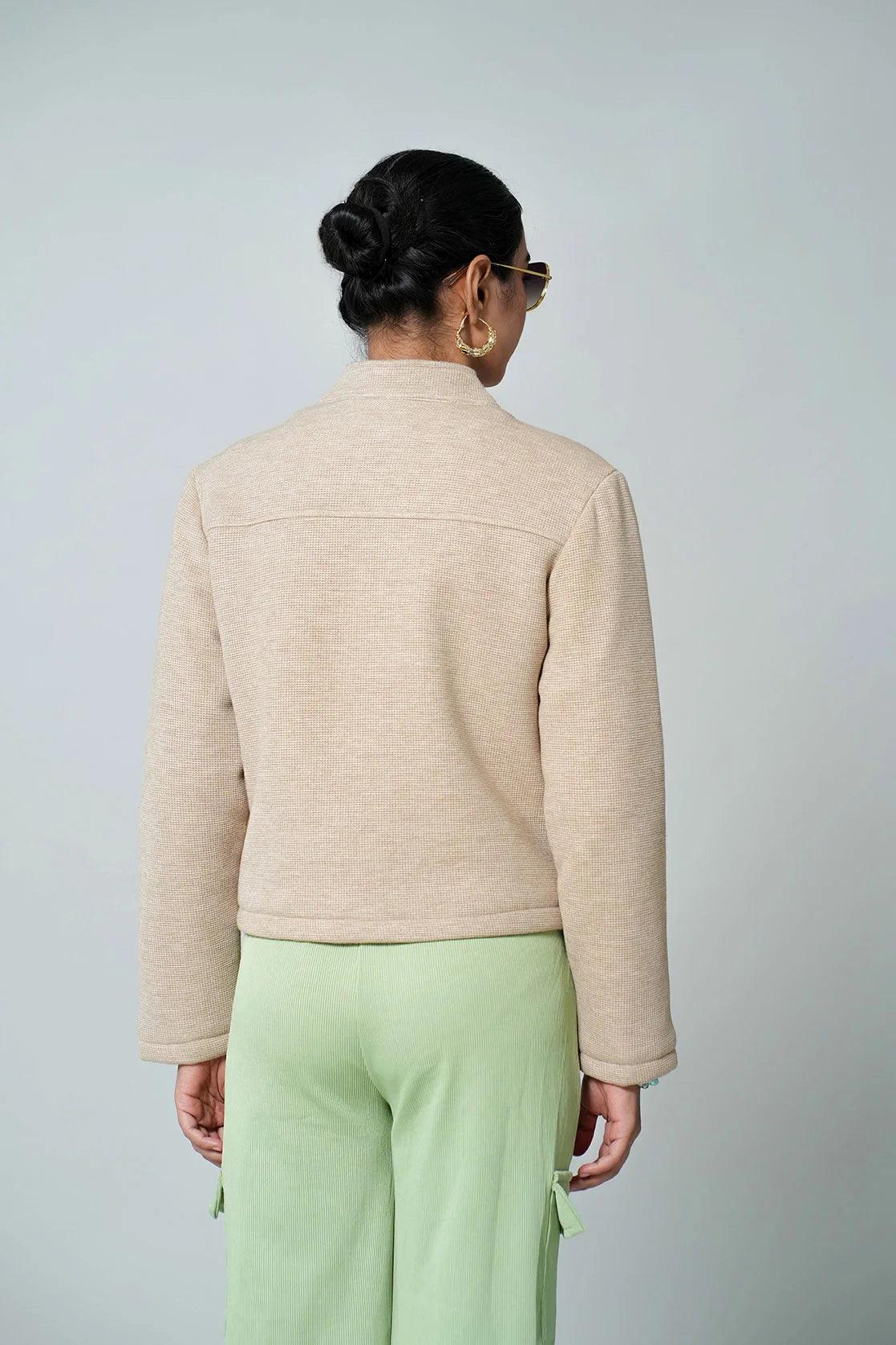 Upgrade your wardrobe with this Fort Collins Women's Knitted Jacket in a timeless beige color. With its button closure, this short length jacket is perfect for any occasion, and can be purchased online from anywhere in India.