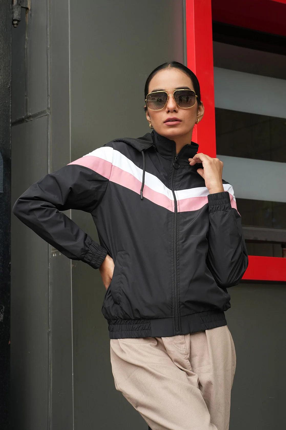 Elevate your wardrobe with the Fort Collins Women's Black Chevron Windbreaker Jacket, featuring an adjustable hood. Available online for easy shopping from anywhere in India.