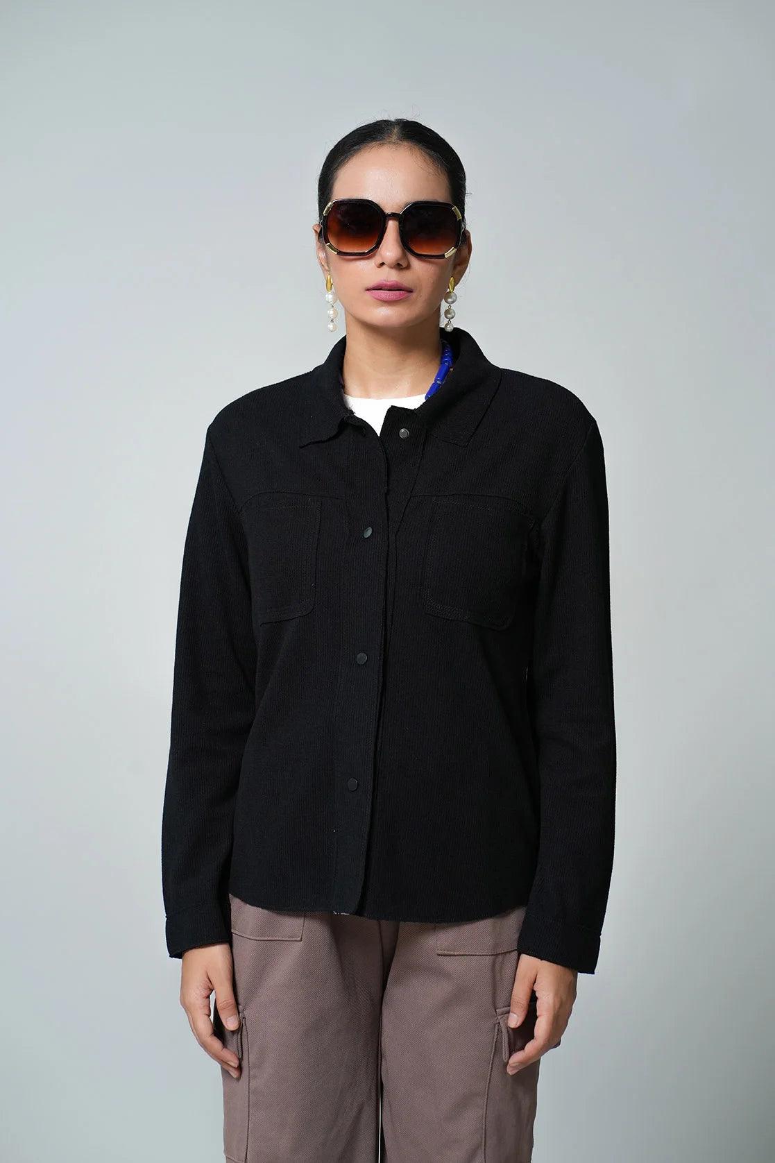 Upgrade your wardrobe with the trendy Women's Black Corduroy Shacket from Fort Collins. This stylish piece is designed with dual chest pockets, and is available for online purchase in India.