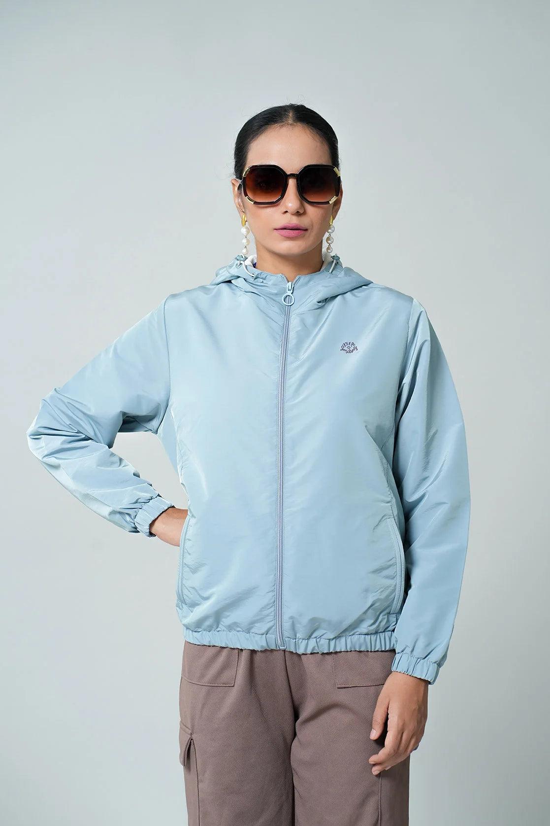 Discover the Fort Collins Women's Light Blue Windbreaker Jacket with Mesh-Net Lining, available for purchase on an online platform in India.