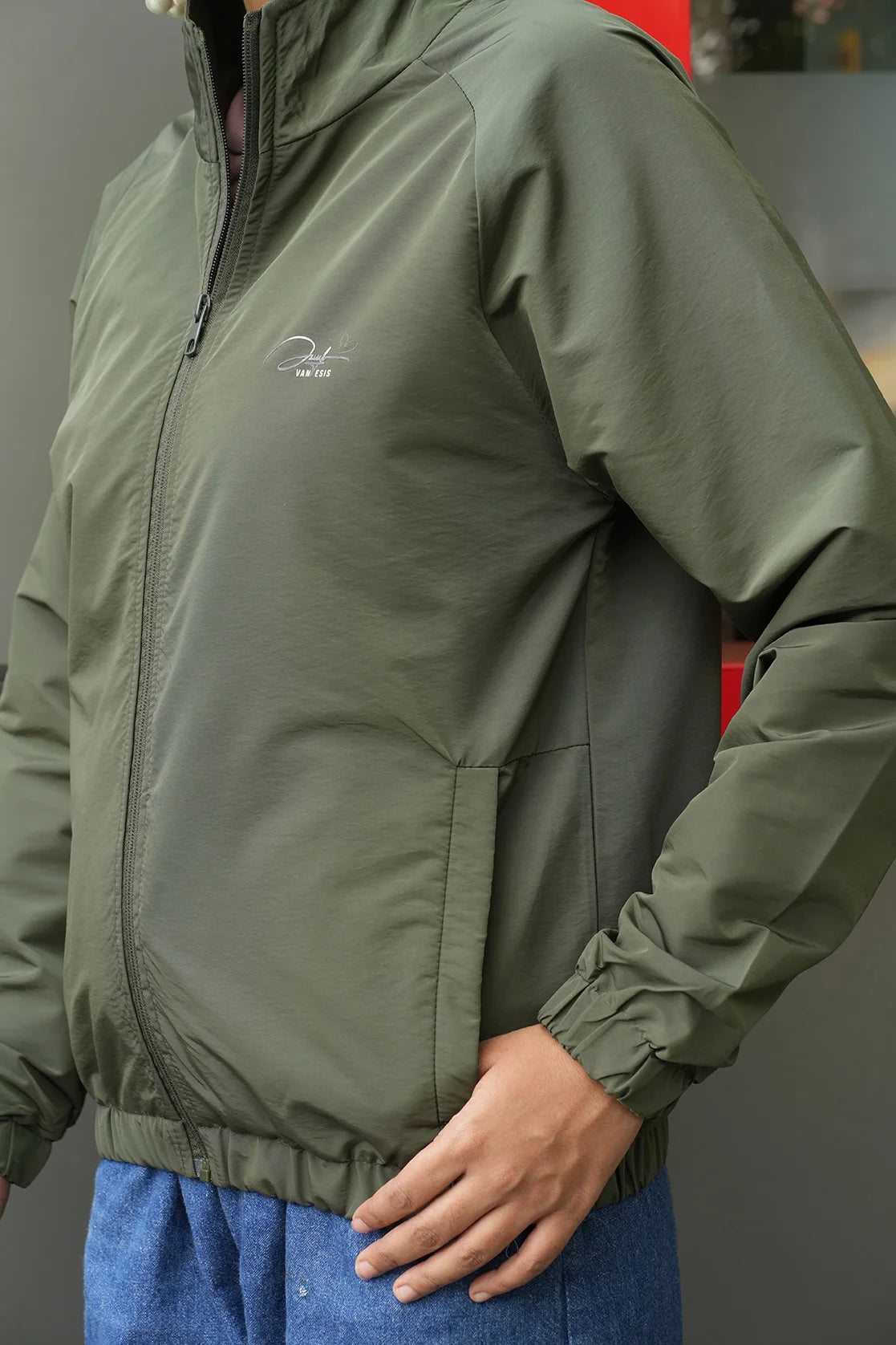 Elevate your wardrobe with the Fort Collins Women's Green Windbreaker Jacket featuring a mesh-net lining. Expertly designed and available for purchase online in India.