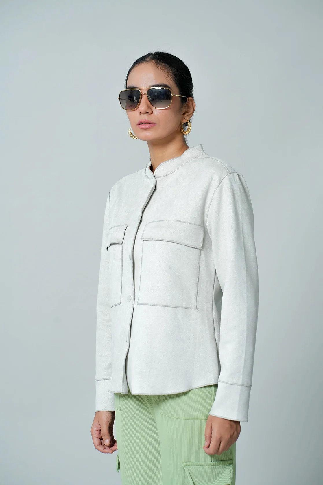 Elevate your wardrobe with this Women's Light Grey Suede Shacket from Fort Collins. Featuring dual chest pockets, this on-trend piece is now available for online purchase in India.