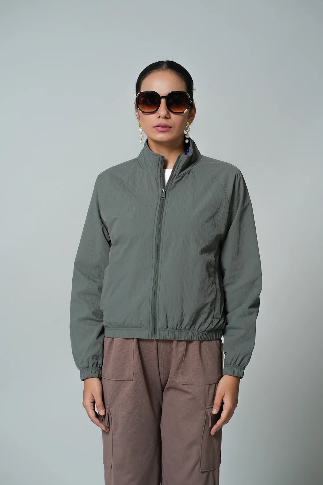 Upgrade your wardrobe with the Women's Olive Lightweight Crop-Length Jacket with Stand Collar by Fort Collins. Shop online from anywhere in India for a trendy and stylish addition to your closet.