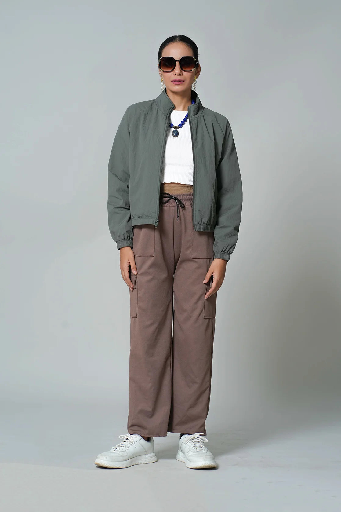 Elevate your style with Fort Collins' Women's Olive Lightweight Crop-Length Jacket. Featuring a stand collar, this trendy wardrobe upgrade is perfect for any fashion-forward individual in India looking to shop online.