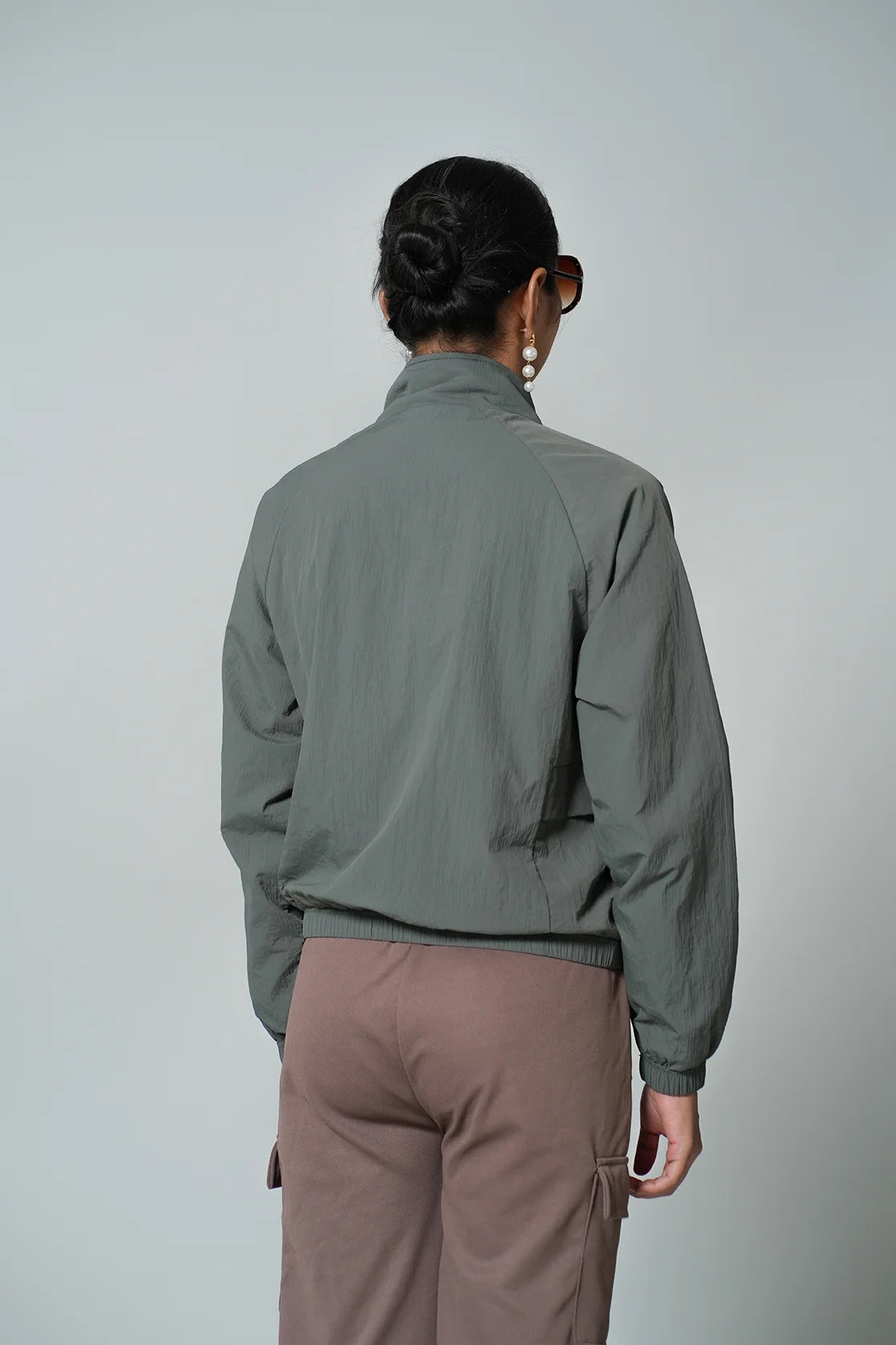 Upgrade your wardrobe with the Fort Collins Women's Olive Lightweight Crop-Length Jacket. Stand out in style with this trendy addition, available online throughout India.