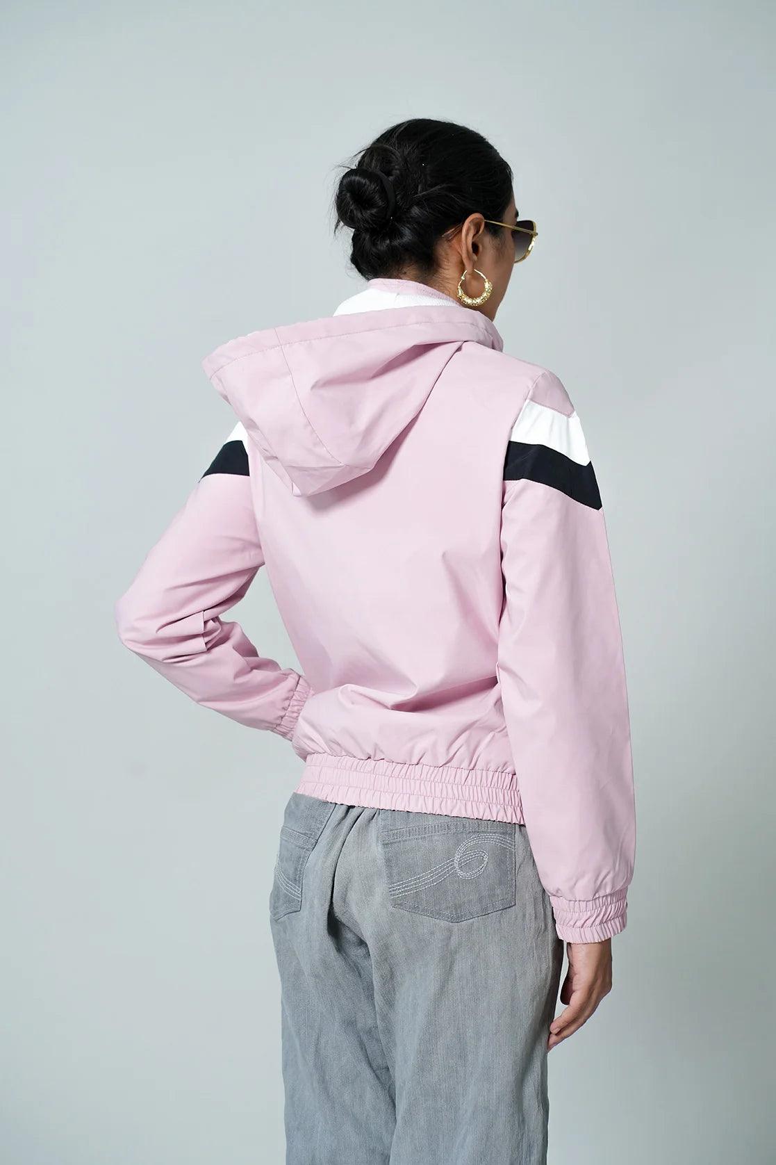 Discover the Fort Collins Women's Pink Lightweight Chevron Windbreaker Jacket featuring an Adjustable Hood. Now, experience the convenience of online shopping in India with this must-have windbreaker.