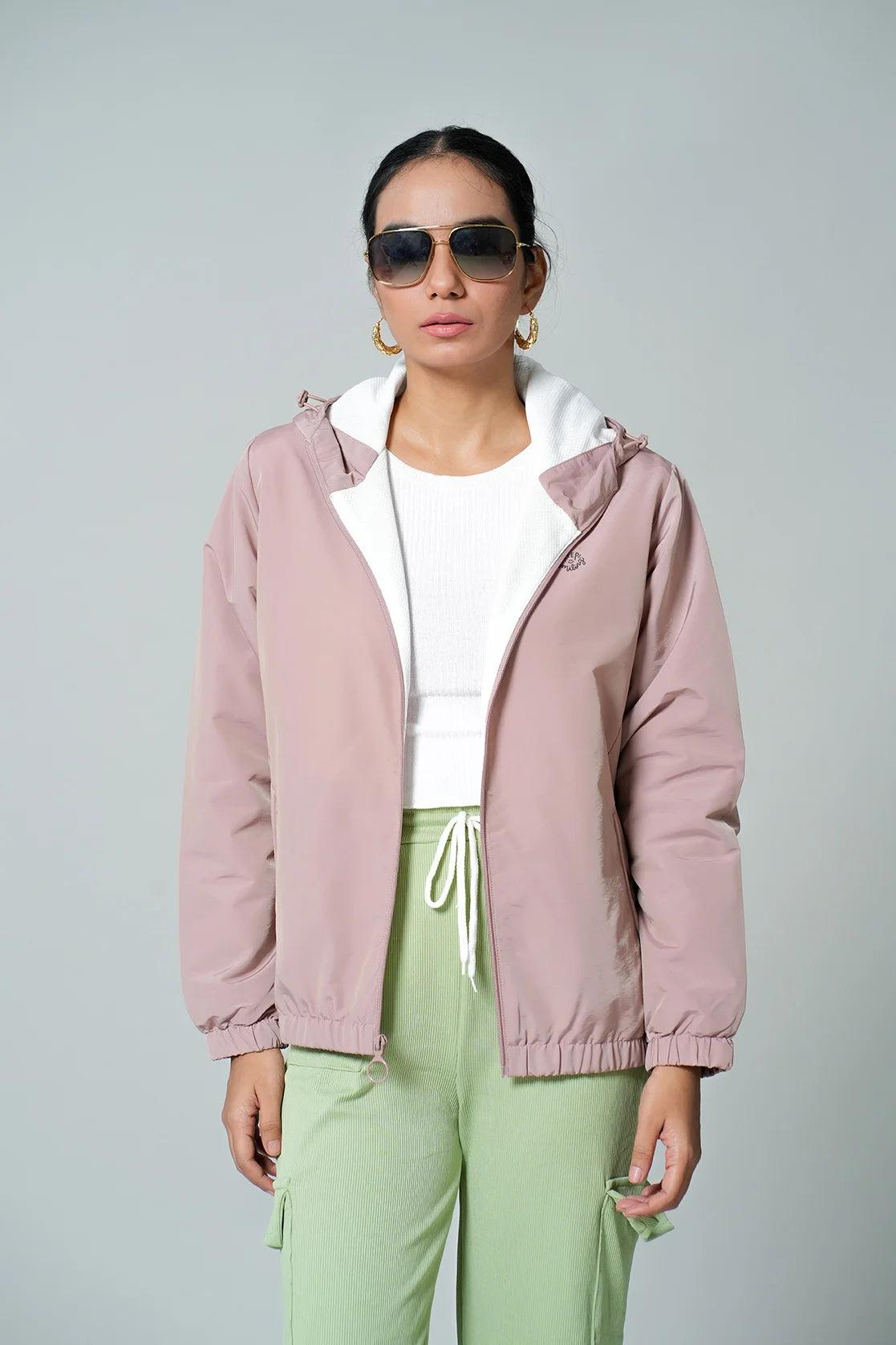 Purchase the lightweight Women's Pink Windbreaker Jacket from Fort Collins, which features an adjustable hood. This product can be conveniently purchased online in India.