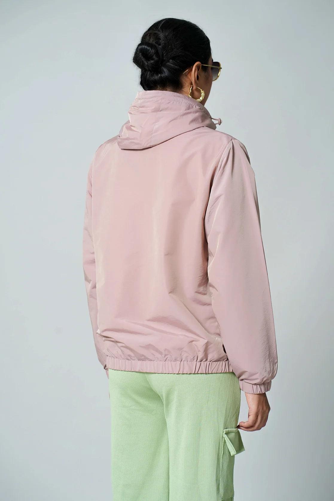 Purchase this lightweight windbreaker jacket with an adjustable hood in pink from Fort Collins online in India.