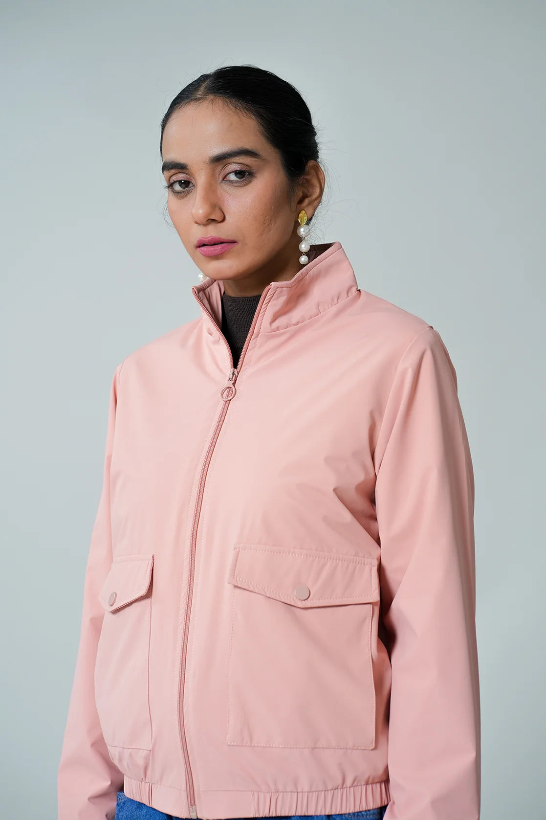 Upgrade your wardrobe with the Women's Pink Windbreaker Jacket with Mesh-Net Lining, available for purchase online from anywhere in India. Developed by industry experts, this stylish jacket is a must-have for any fashion-conscious individual.