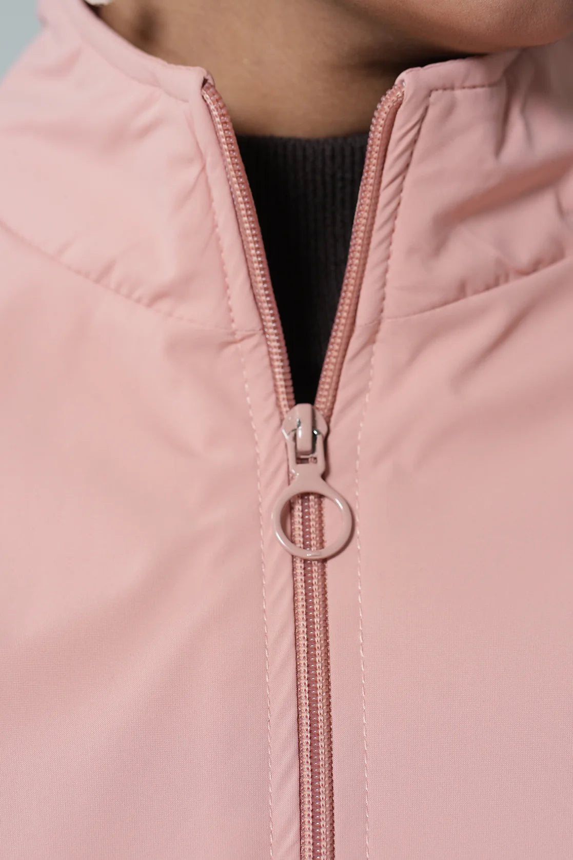 Experience ultimate comfort and style with our Women's Pink Windbreaker Jacket, equipped with a mesh-net lining. Elevate your wardrobe with this must-have piece, available for purchase online from anywhere in India.