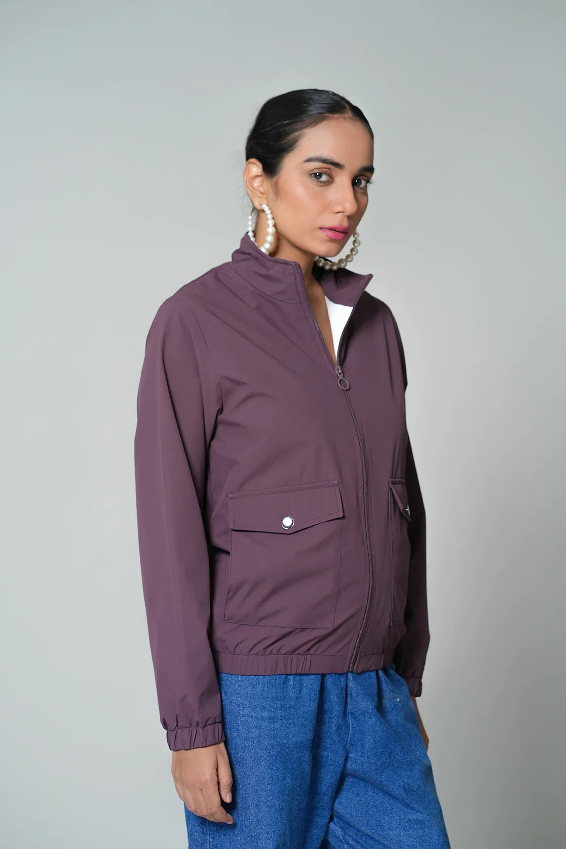 Upgrade your wardrobe with the Women's Wine Windbreaker Jacket by Fort Collins. This trendy piece features a mesh-net lining and is available for purchase online from anywhere in India. Shop now and stay stylish and comfortable!