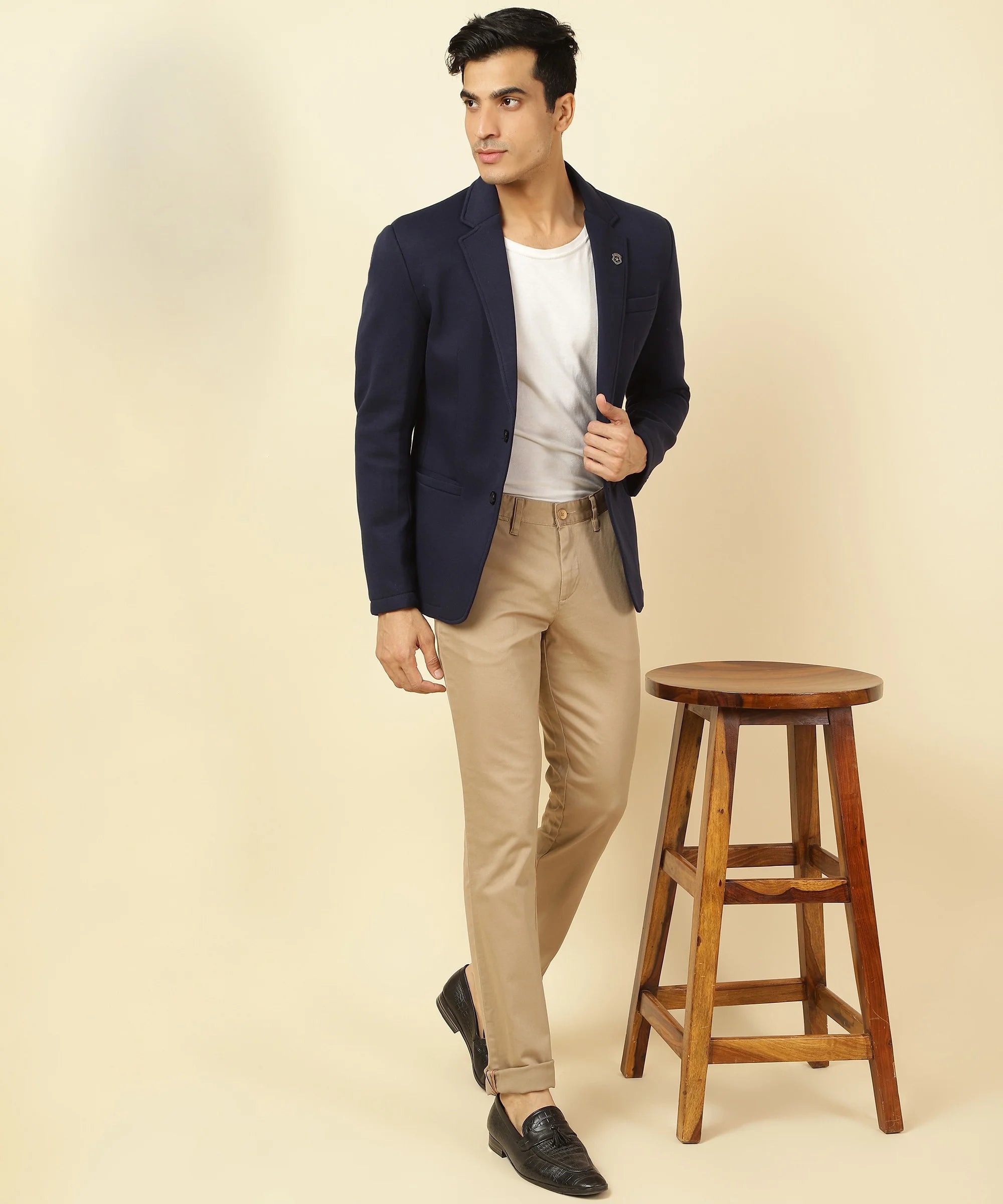 Update your wardrobe with the sophisticated Men's Navy Knitted Blazer, made with a comfortable cotton blend and featuring a notched lapel. Available for purchase online from anywhere in India.