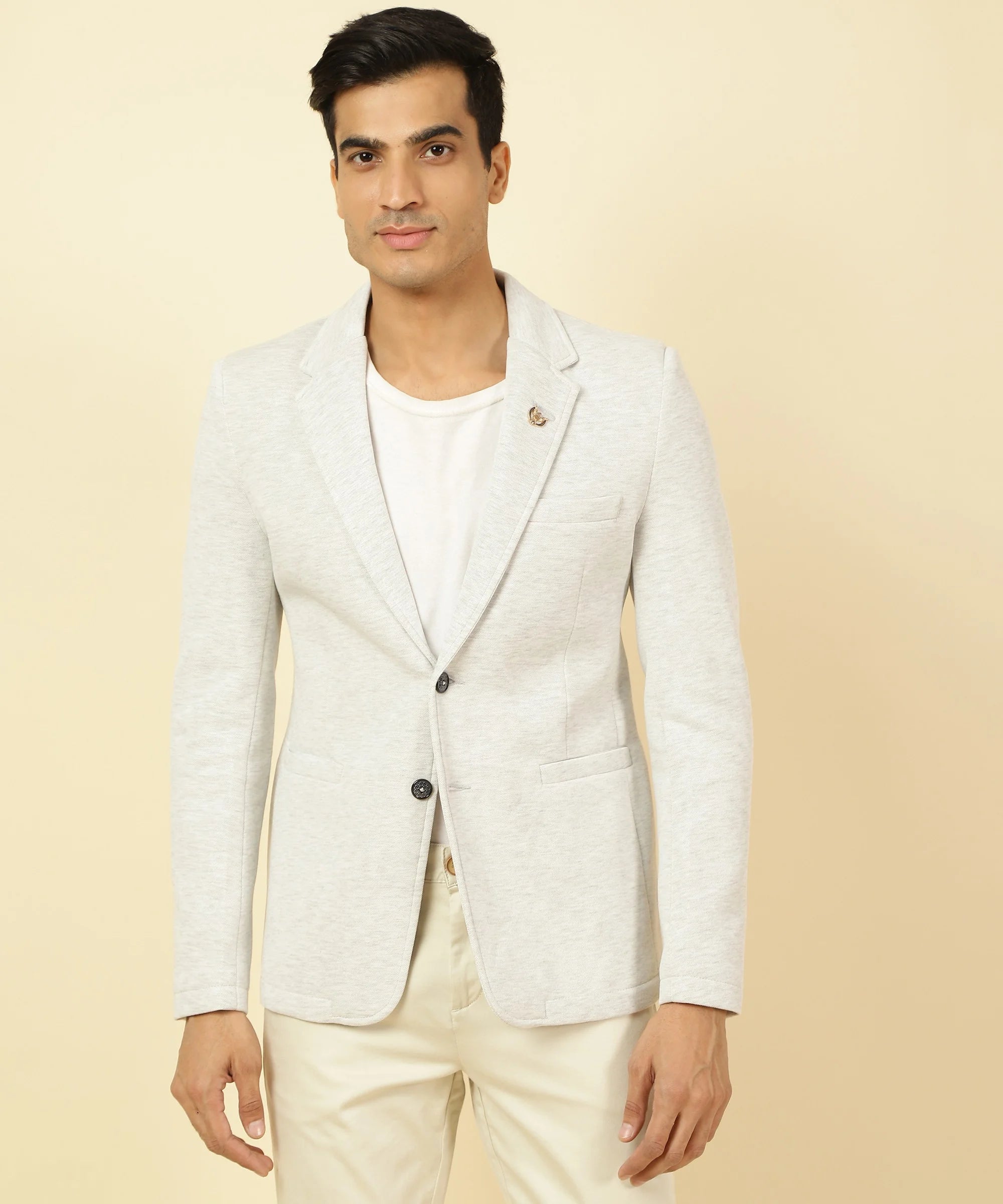 Discover the sleek style and modern design of the Men's Off White Knitted Blazer with Notched Lapel, available online at Fort Collins. Elevate your wardrobe with this must-have piece, perfect for any occasion and accessible from anywhere in India.