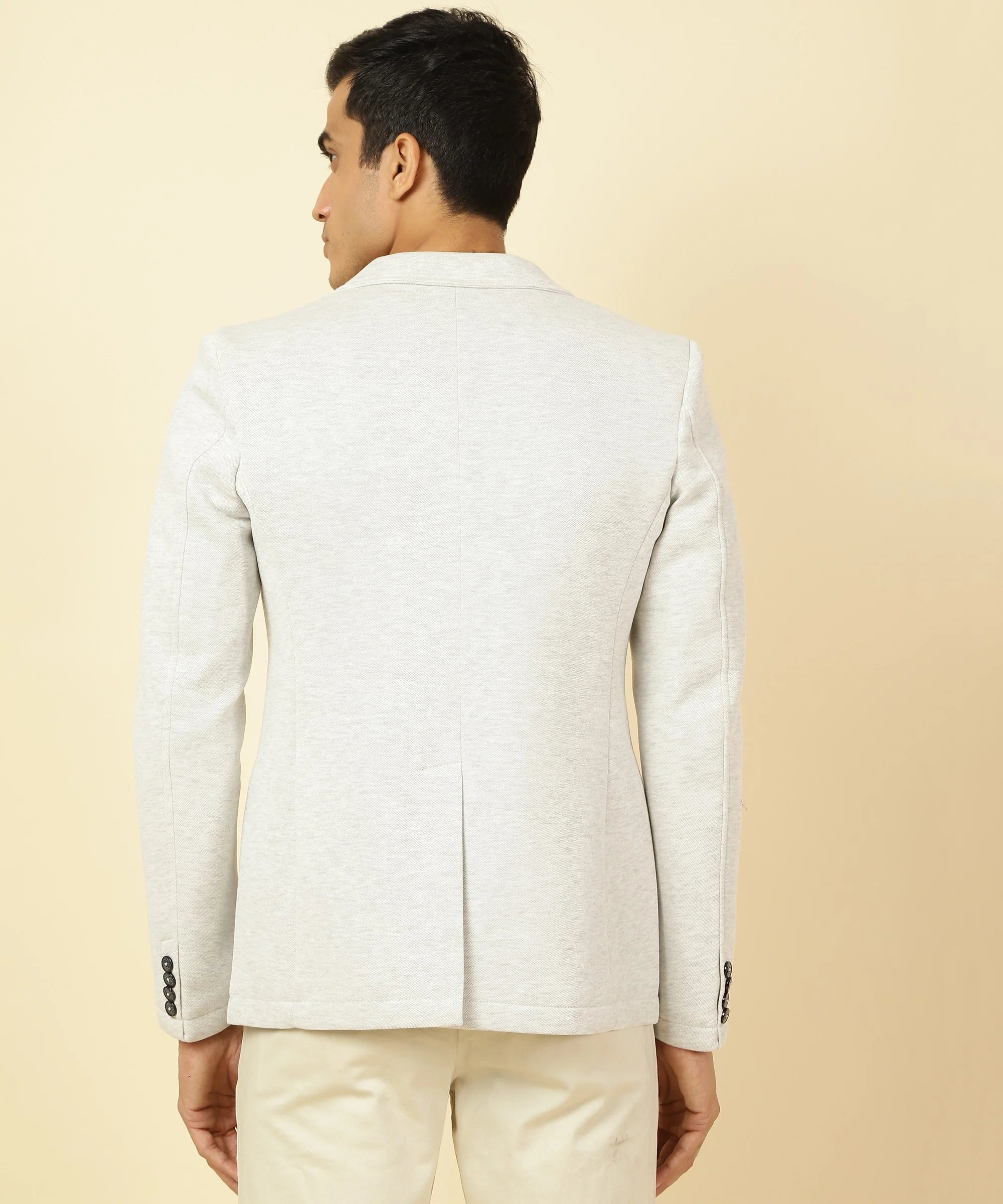 Purchase the Men's Off White Knitted Blazer with Notched Lapel from Fort Collins. This stylish addition to your wardrobe can be conveniently bought online from anywhere in India.