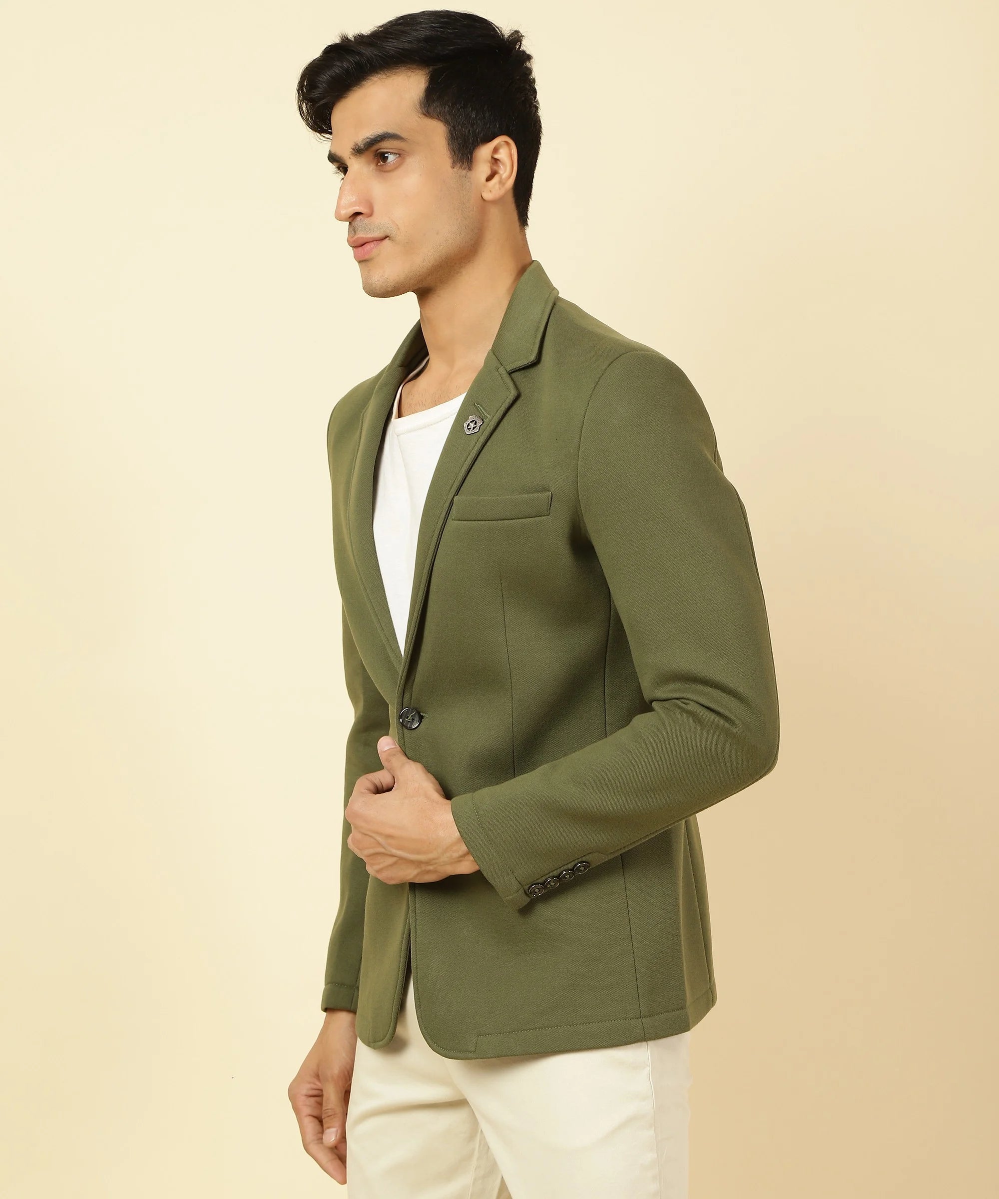 Experience style and comfort with the Men's Olive Green Knitted Blazer featuring a classic Notched Lapel, exclusively from Fort Collins. Shop now for a fashionable wardrobe, available online throughout India.