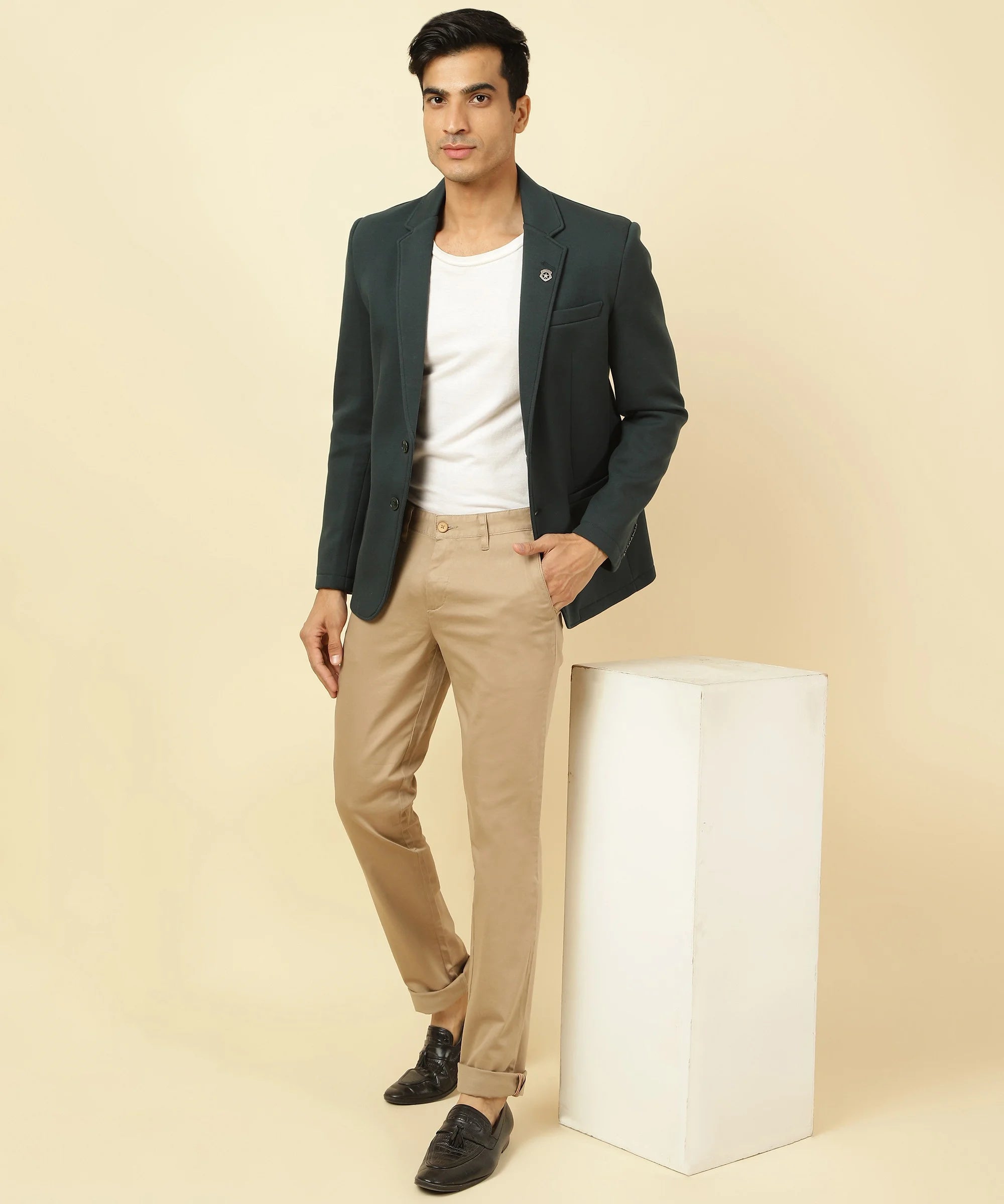 Shop for a stylish wardrobe addition from anywhere in India with the Men's Shadow Green Knitted Blazer, featuring a classic notched lapel, by Fort Collins.