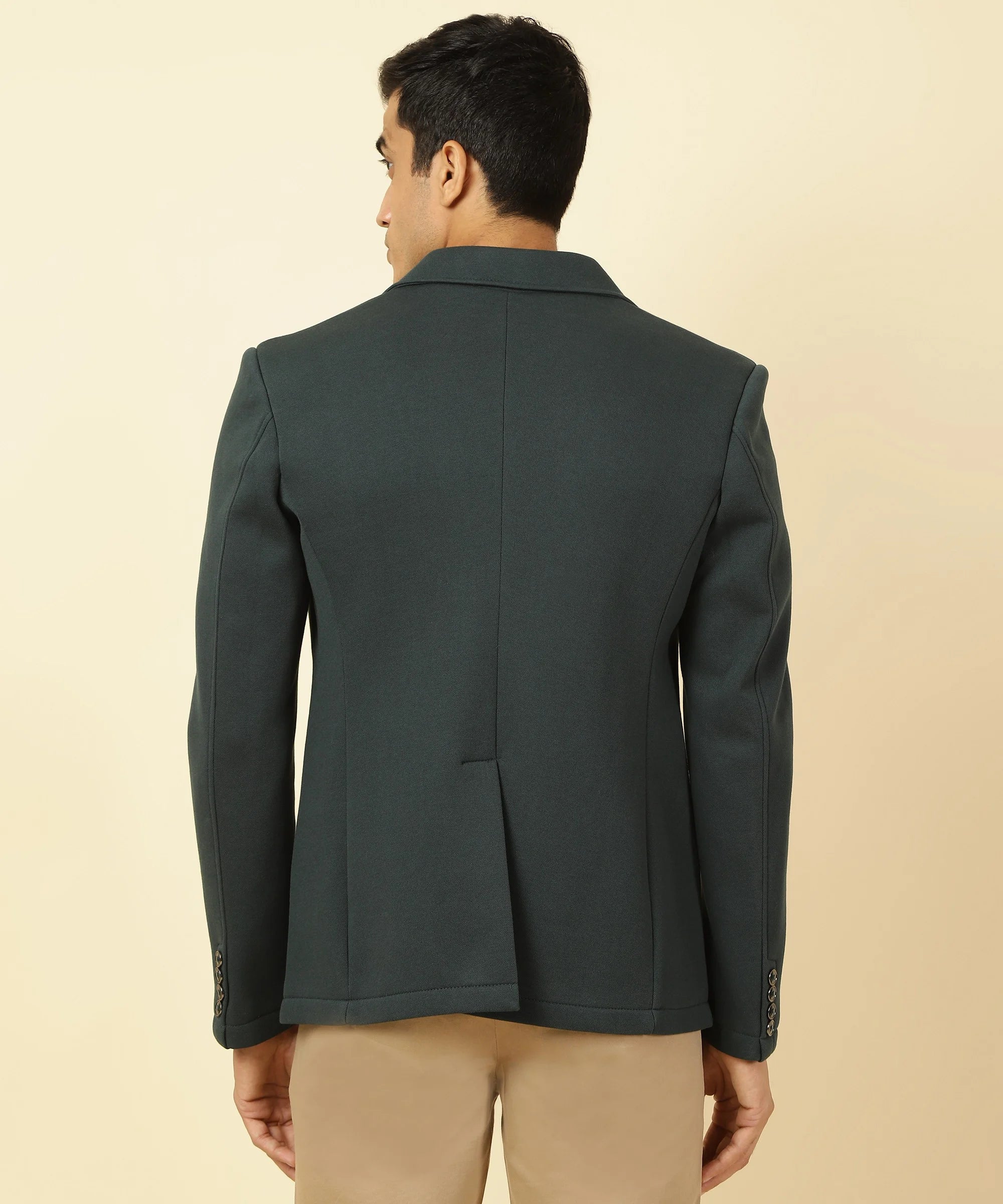 This Fort Collins Men's Shadow Green Knitted Blazer features a classic Notched Lapel and is available for purchase online in India. Enhance your wardrobe with this stylish option.