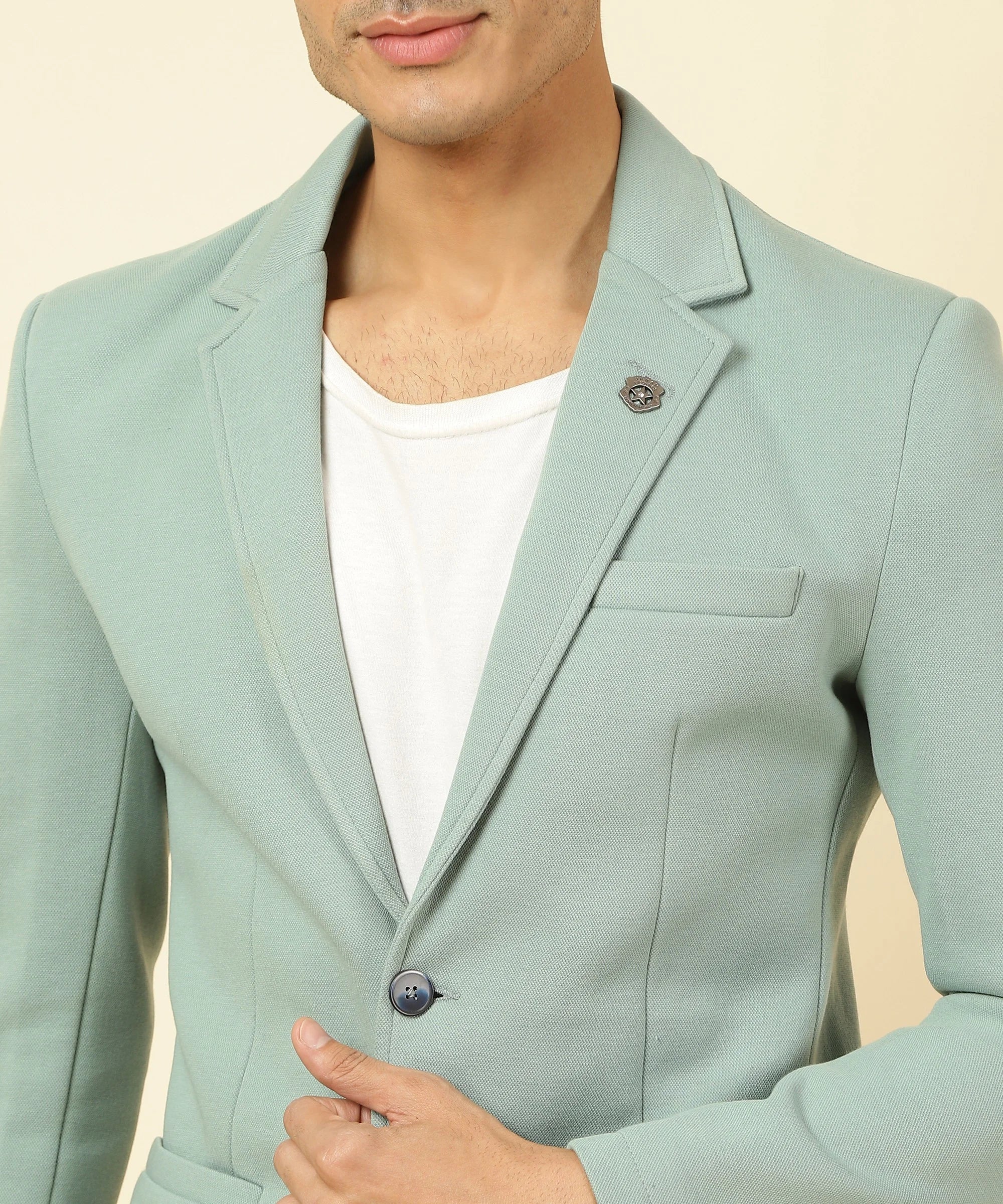 Upgrade your wardrobe with the Fort Collins Men's Tiffany Knitted Blazer, featuring a notched lapel and made from a cotton blend. Available for purchase online from India's top clothing retailer.