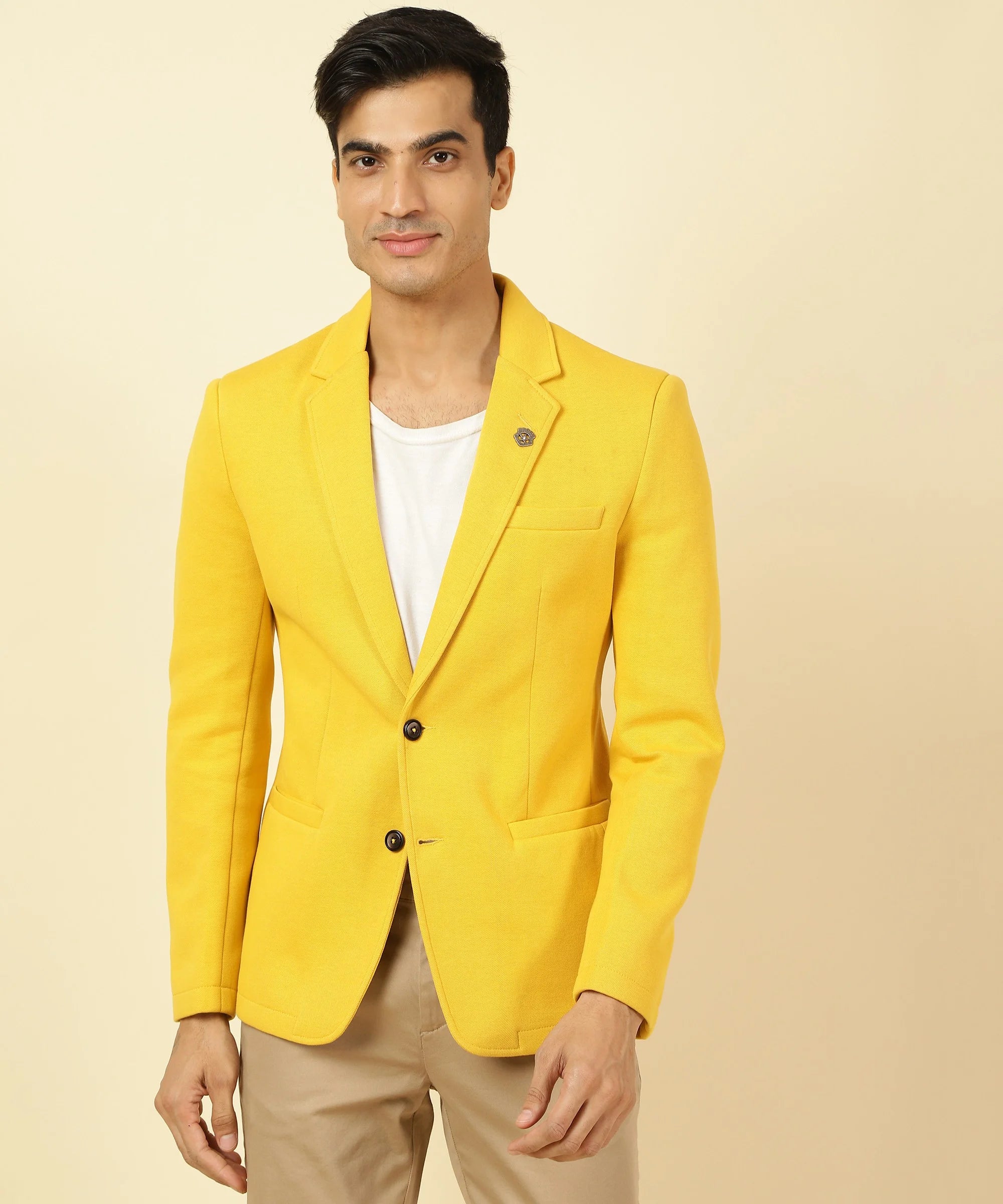 Upgrade your wardrobe with the Fort Collins Men's Yellow Cotton Blend Knitted Blazer, featuring a stylish notched lapel. Shop now from anywhere in India for a fashionable look.