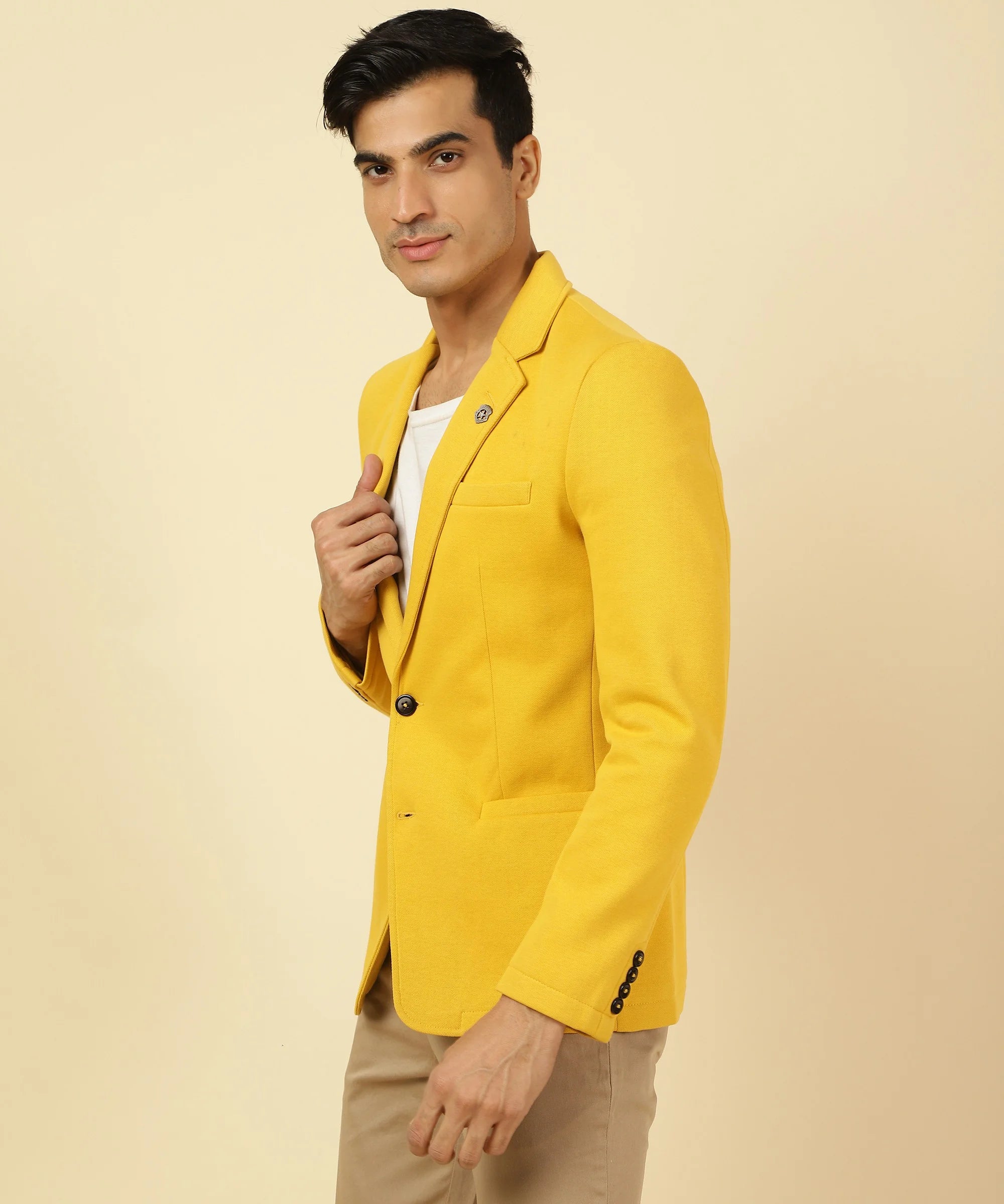 Discover the perfect blend of comfort and style with our Men's Yellow Knitted Blazer from Fort Collins. Made from a premium cotton blend, this blazer features a classic notched lapel design, making it a must-have addition to your wardrobe. Shop now and elevate your fashion game with just a click, no matter where you are in India.