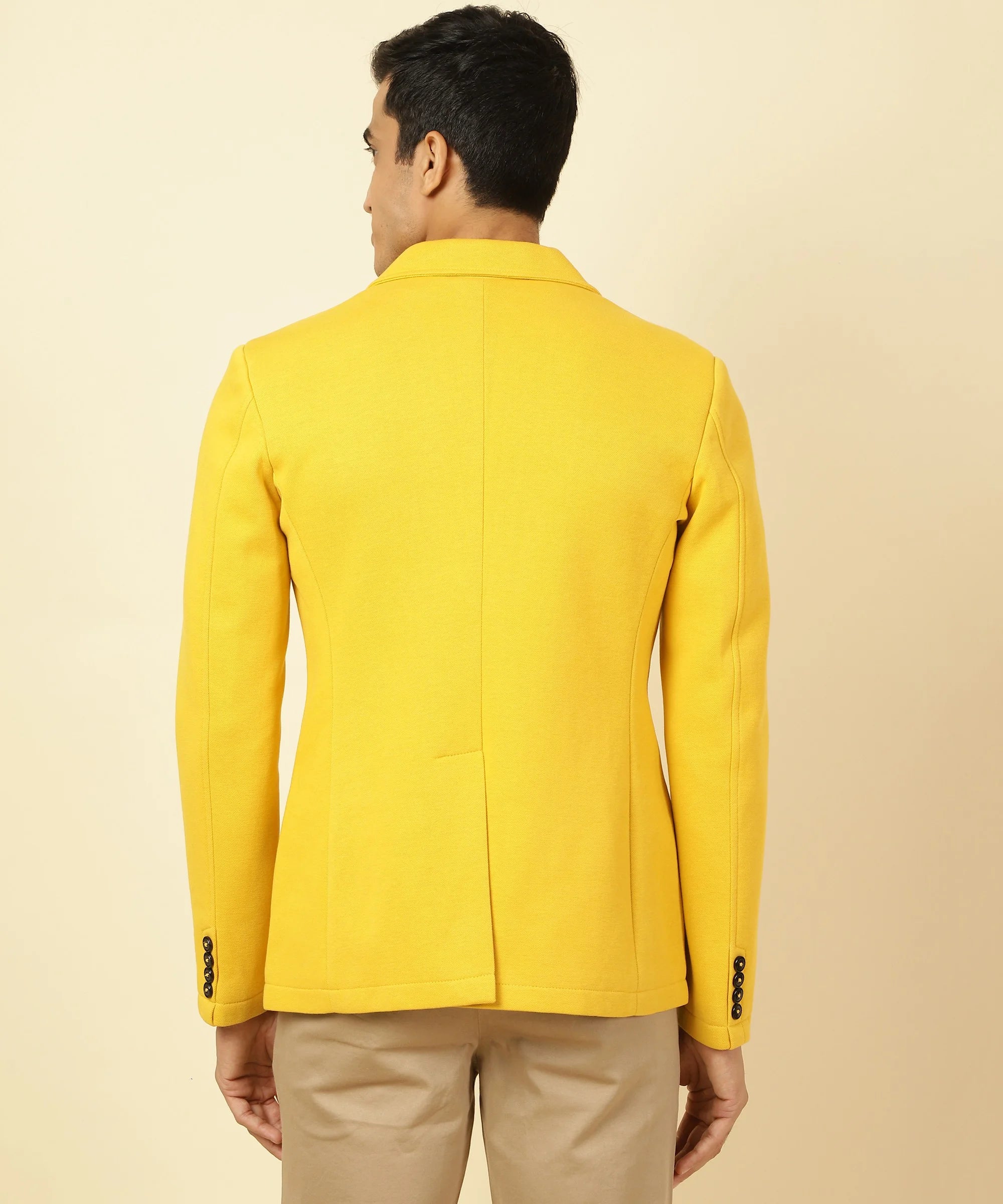 Upgrade your wardrobe with a trendy Fort Collins Men's Yellow Cotton Blend Knitted Blazer featuring a sophisticated Notched Lapel. Available for online purchase in India now.